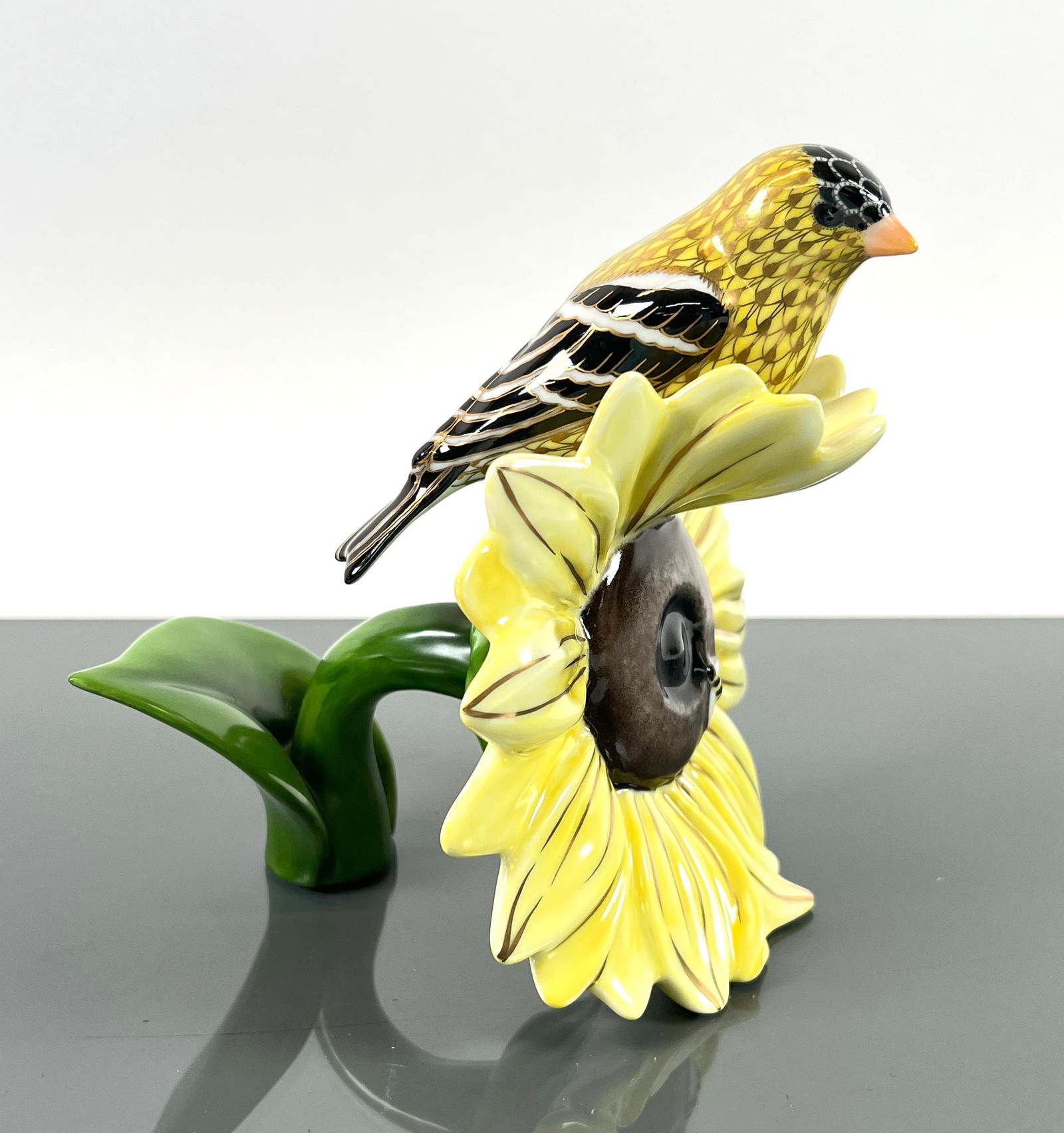 HEREND GOLDFINCH ON SUNFLOWER: HEREND RESERVE GOLDFINCH ON SUNFLOWER 16255. HAND-PAINTED PORCELAIN, FISHNET. ORIGINAL BOX WITH MATCHING CERTIFICATE. ORIGINAL INVOICE $1,578, SCULLY & SCULLY, NEW YORK. 6.25"X5.75"X3.5. BOX IS 8.25"X
