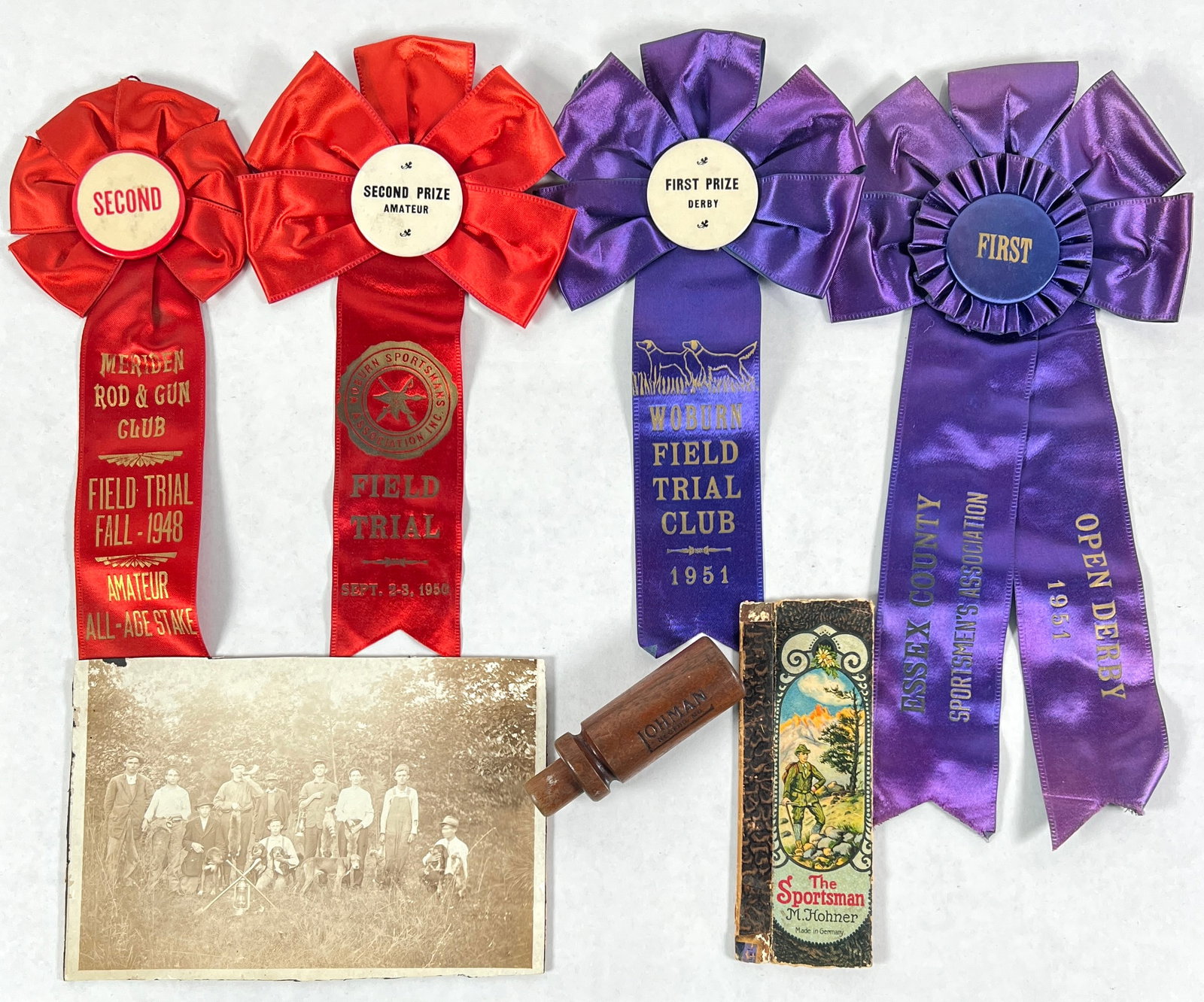 SPORTSMAN'S COLLECTION: RIBBON AWARDS, OHMAN DUCK CALL, RACCOON HUNT PHOTOGRAPH.