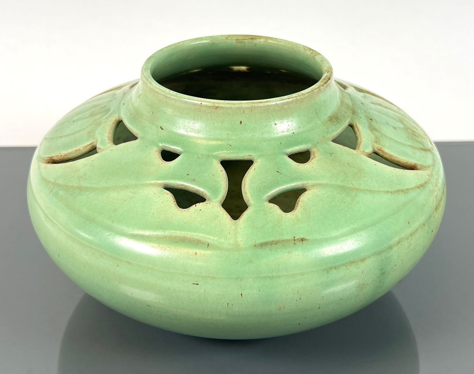 SHEARWATER POTTERY VASE: RETICULATED DESIGNS IN CELADON GREEN WITH BROWN ACCENTING UNDERTONES. MARKED. 8"X8"X4.5"