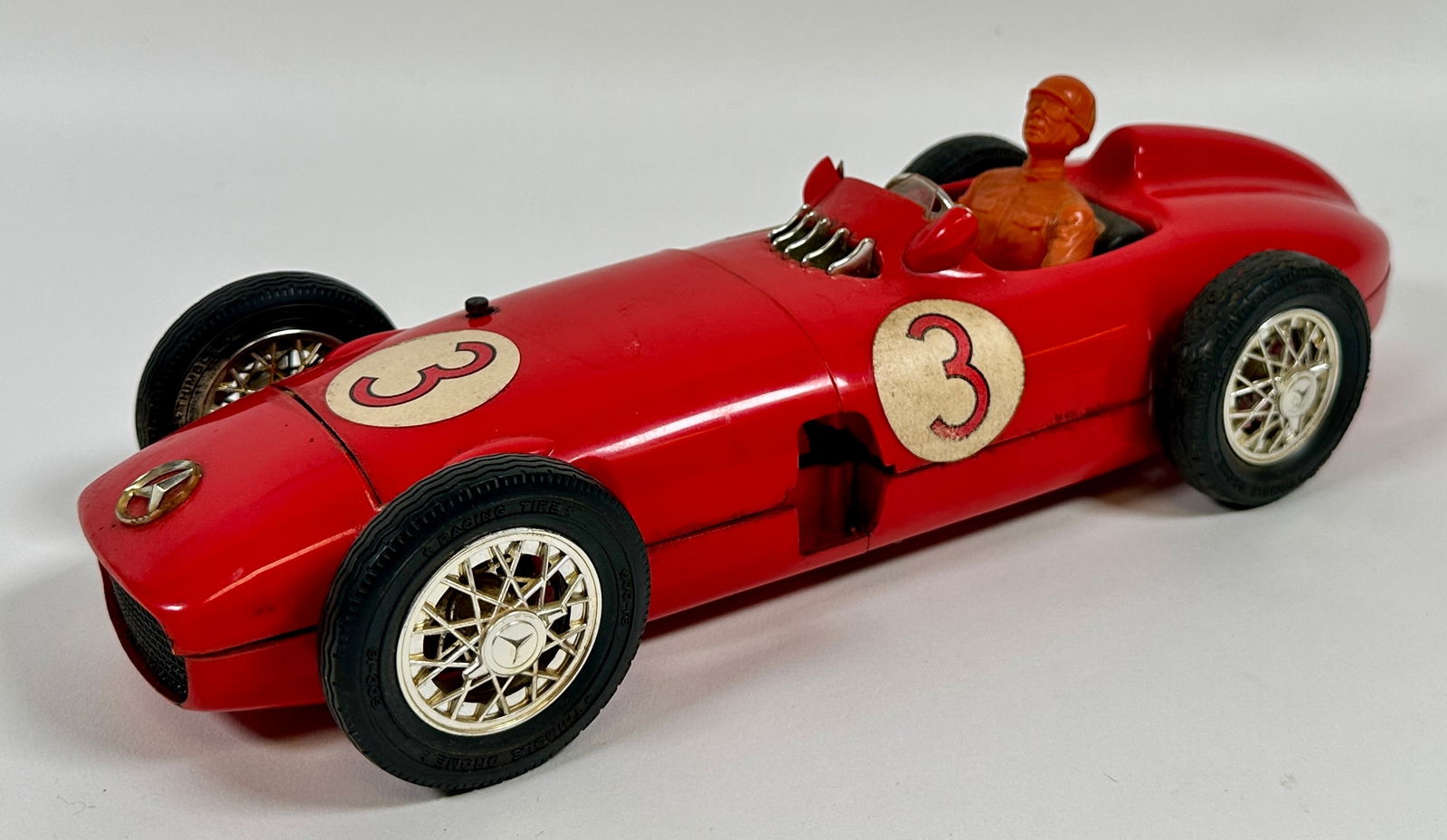 COX THIMBLE DROME W-196 RACER: VINTAGE MERCEDES BENZ THIMBLE RACER. CRACK IN LOWER STRUCTURE AS SHOWN. 14"L