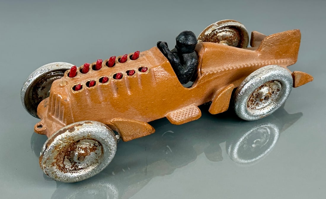 HUBLEY TOYS ROCKET RACER CAST IRON TOY: FLAMING ENGINE ACTION, SCATTERED RUST/PITTING, OLDER RESTORATION. 10.5"X3.5"X3.5"
