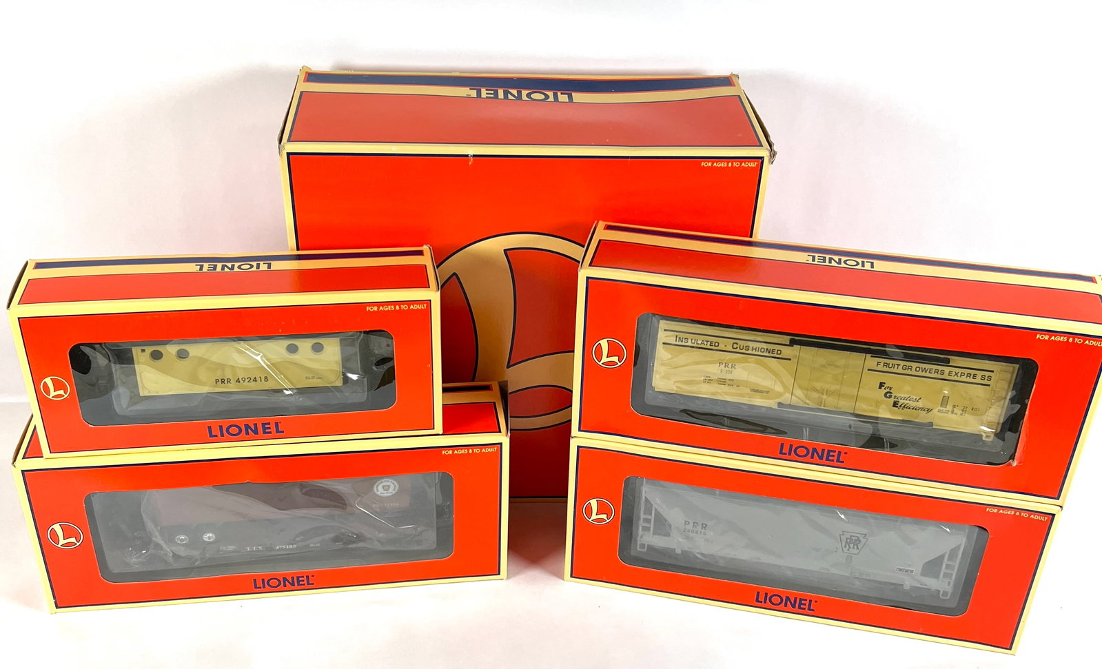 LIONEL ELECTRIC TRAINS - 6-21751 PENN ROLLING STOCK: 4-PACK - PENN ROLLING STOCK. FLATCAR WITH TRAILER, REEFER CAR, COVERED HOPPER, PORTHOLE CABOOSE. AS NEW IN ORIGINAL BOX. CARTON IS 14"X7"X16"