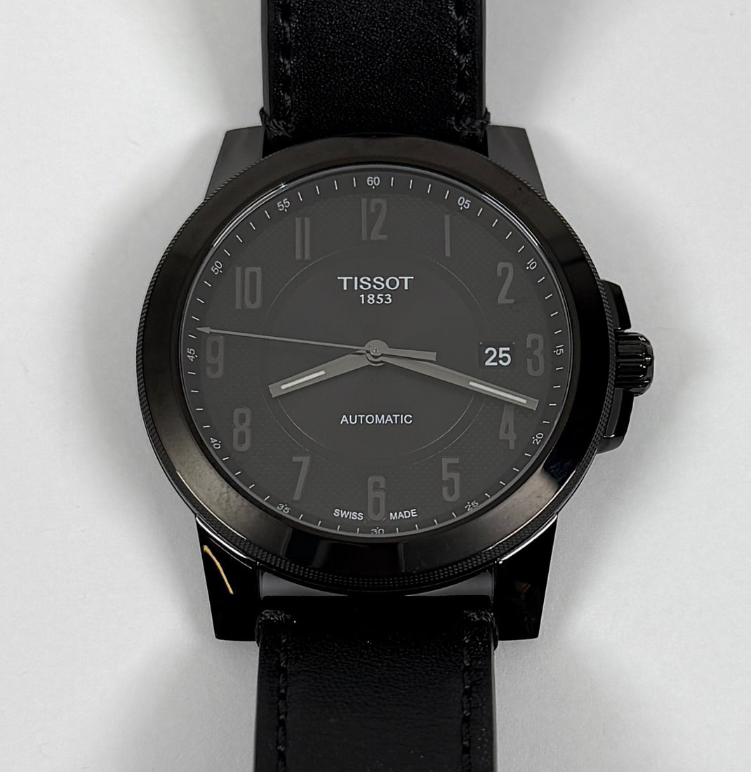 TISSOT T-CLASSIC MEN'S WATH: SWISS MOVEMENT, T-CLASSIC LINE, PVD COATED STAINLESS STEEL CASE, BLACK DIAL, DATE WINDOW, SAPPHIRE CRYSTAL. W/R TO 100M. RUNNING.
