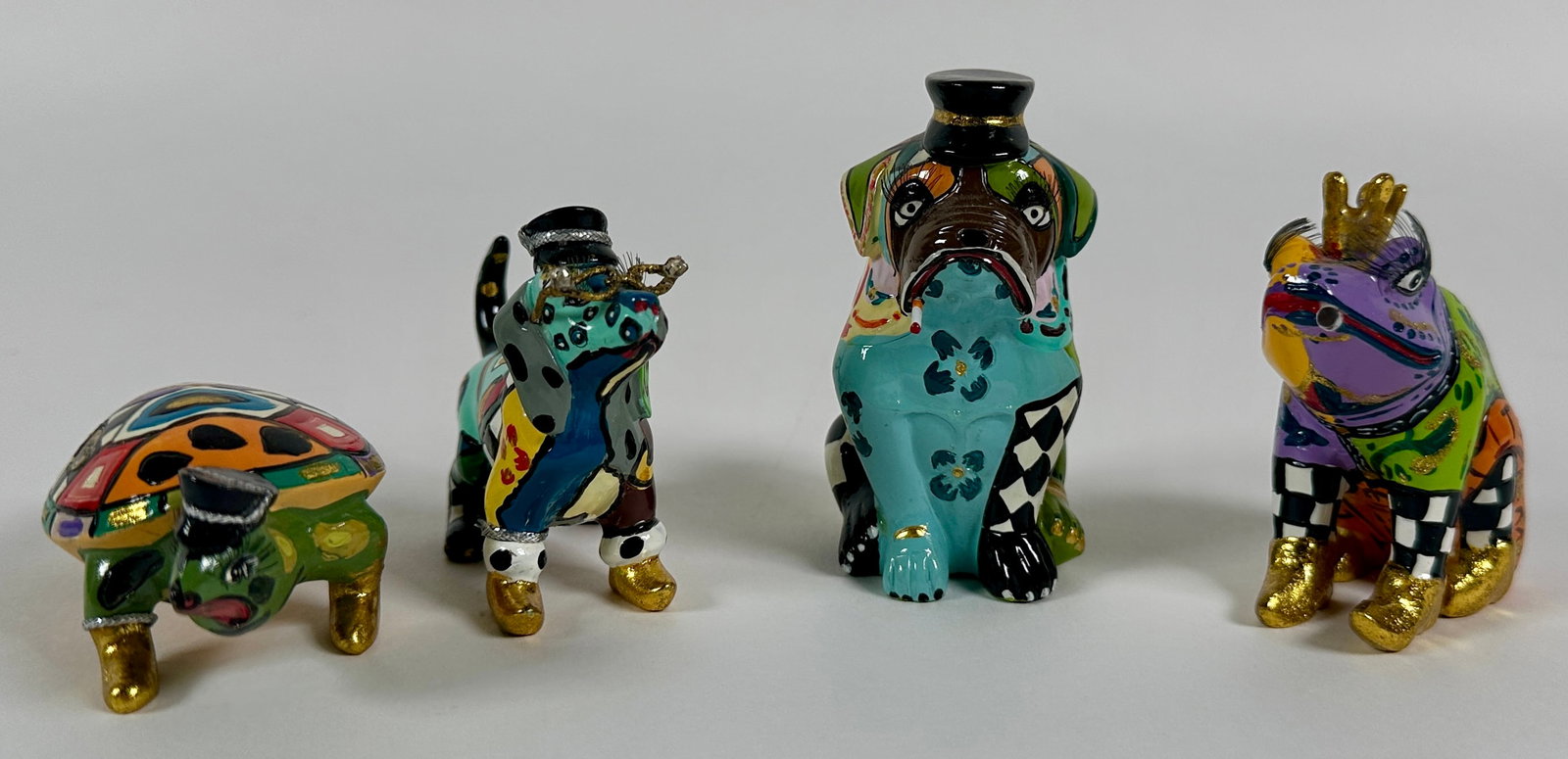 TOM'S DRAG - TOM HOFFMAN - ANIMALS: COLORFUL, WHIMSICAL, POP-ART INFLUENCED FIGURE DESIGNED BY TOM HOFFMAN (AMERICAN, 1956-2012). DOGS, FROG AND TURTLE IN DIMINUTIVE FORM. LARGEST IS 3"X1"X1"
