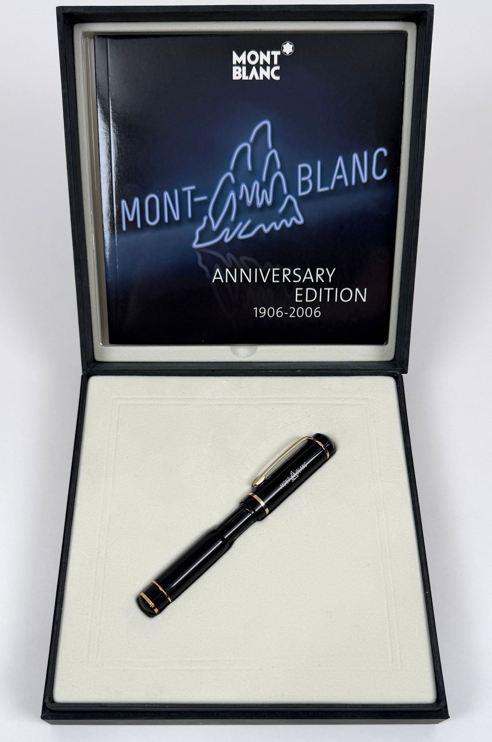 MONTBLANC 100TH ANNIVERSARY EDITION PEN: MONTBLANC MODEL M10028 LIMITED EDITION ROLLERBALL - BALLPOINT PEN. CELEBRATING 100TH ANNIVERSARY. INLCUDES ORIGINAL BOX, BOOKLET AND OUTER CARTON. OUTERCARTON WITH WEAR.