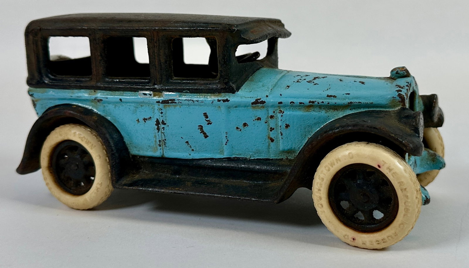 ARCADE TOYS CAST IRON BUICK: REPLACEMENT TIRES, SCATTERED RUST, ORIGINAL FINISH. PLAYWEAR CONSISTENT WITH AGE AND USE. 8"X4"X4"