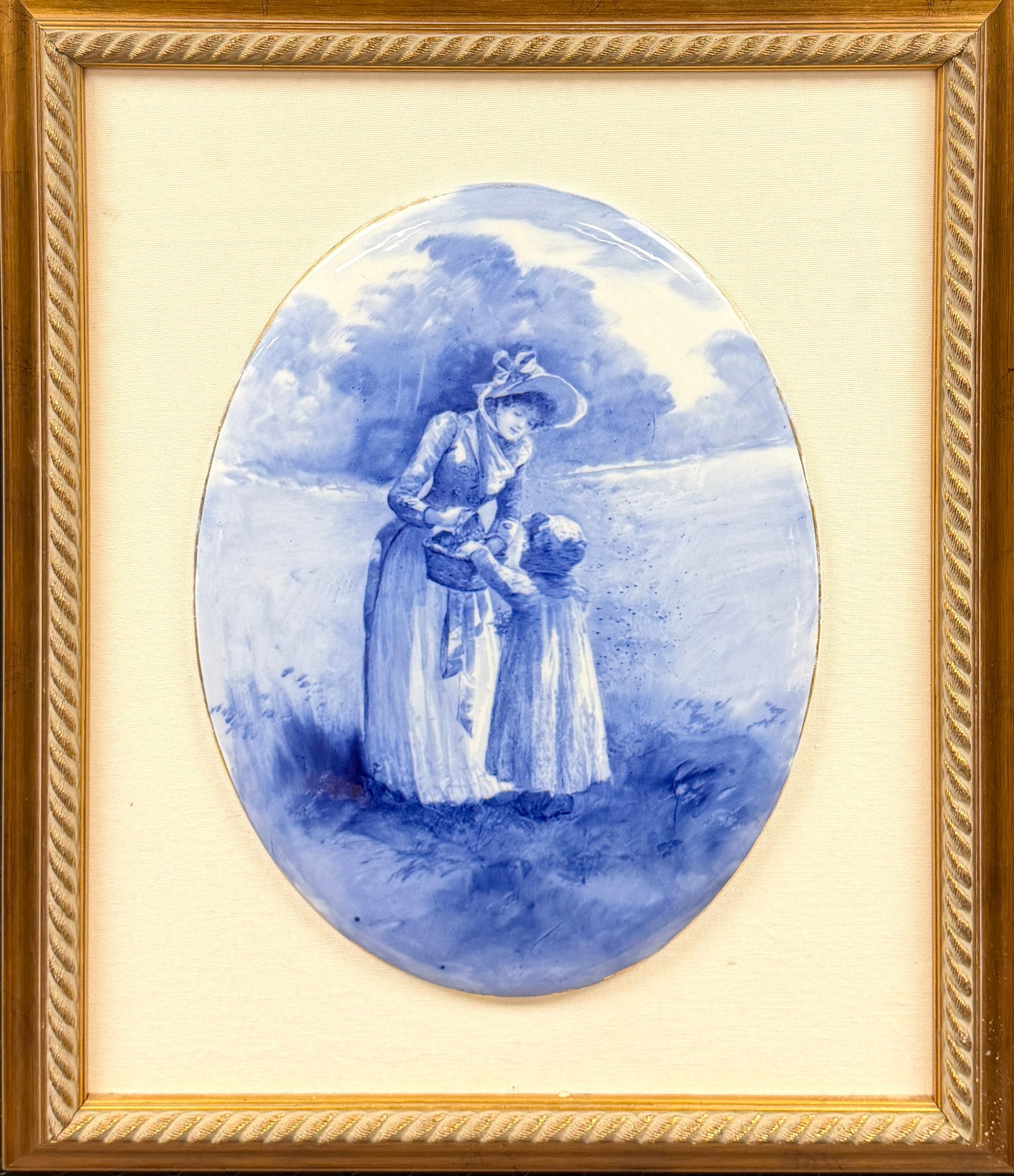 DOULTON BURSLEM ENGLAND PORCELAIN PLAQUE: FROM THE BLUE CHILDREN/BABES IN THE WOODS SERIES, EARLY 20TH CENTURY. MOUNTED ON FRAME. PLAQUE, 14"X10.5". FRAMED, 21"X17.5"
