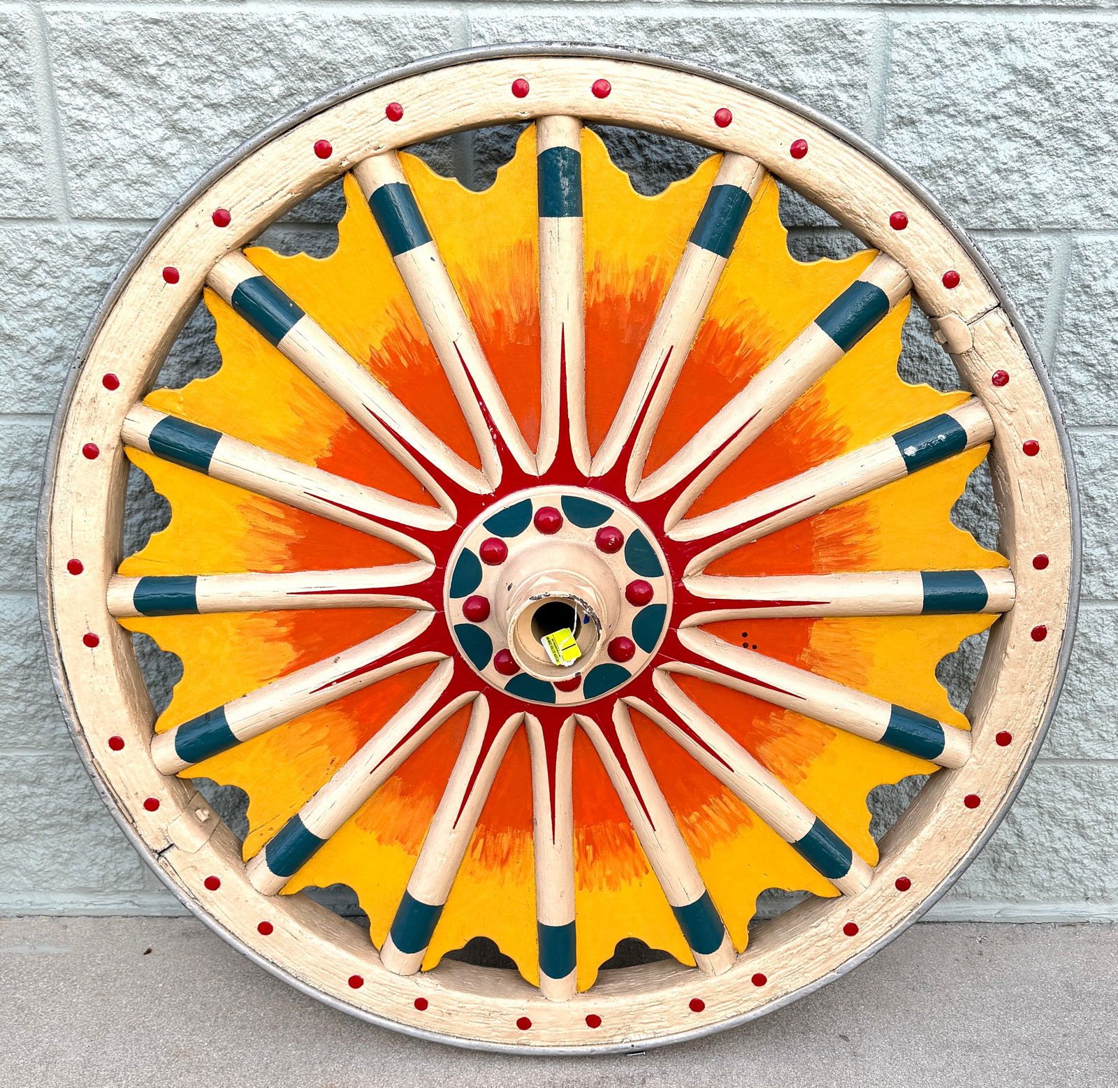VINTAGE CIRCUS WAGON WHEEL: ORIGINAL CIRCUS WAGON WHEEL, RALPH DECKER COLLECTION. SUNBURST DECORATED. 40". REQUIRES LOCAL PICK UP