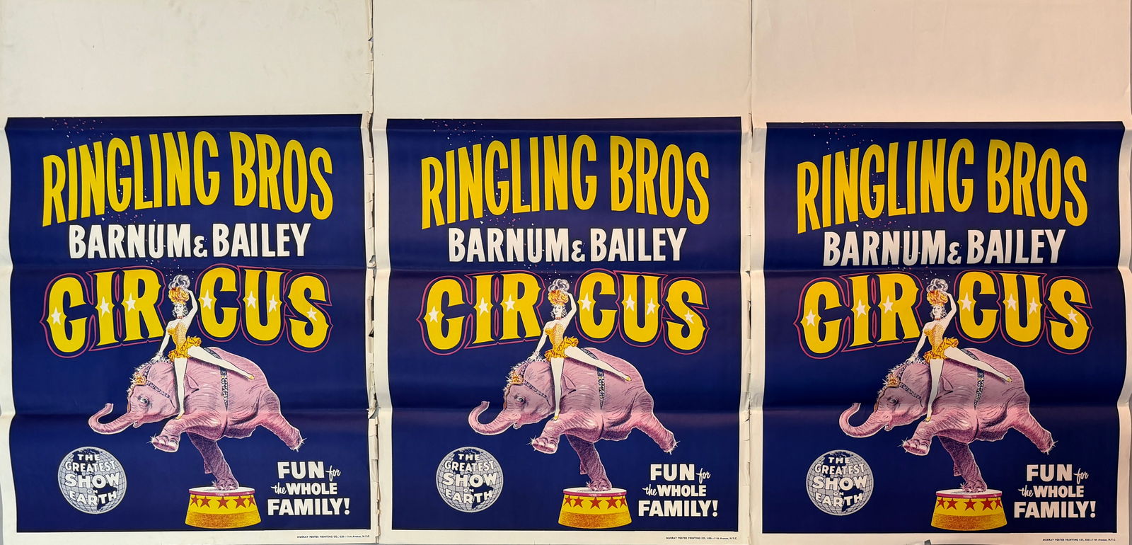 RINGLING BROS. BARNUM BAILEY CIRCUS POSTERS: TRIO OF NEW OLD STOCK POSTERS FOR THE RBBB CIRCUS, 1950'S. TITLE SHEET WITH PINK ELEPHANT AND RIDER. FOLDS AS ISSUED. MINOR SHELF WEAR AT EDGES. EACH 30"X43"