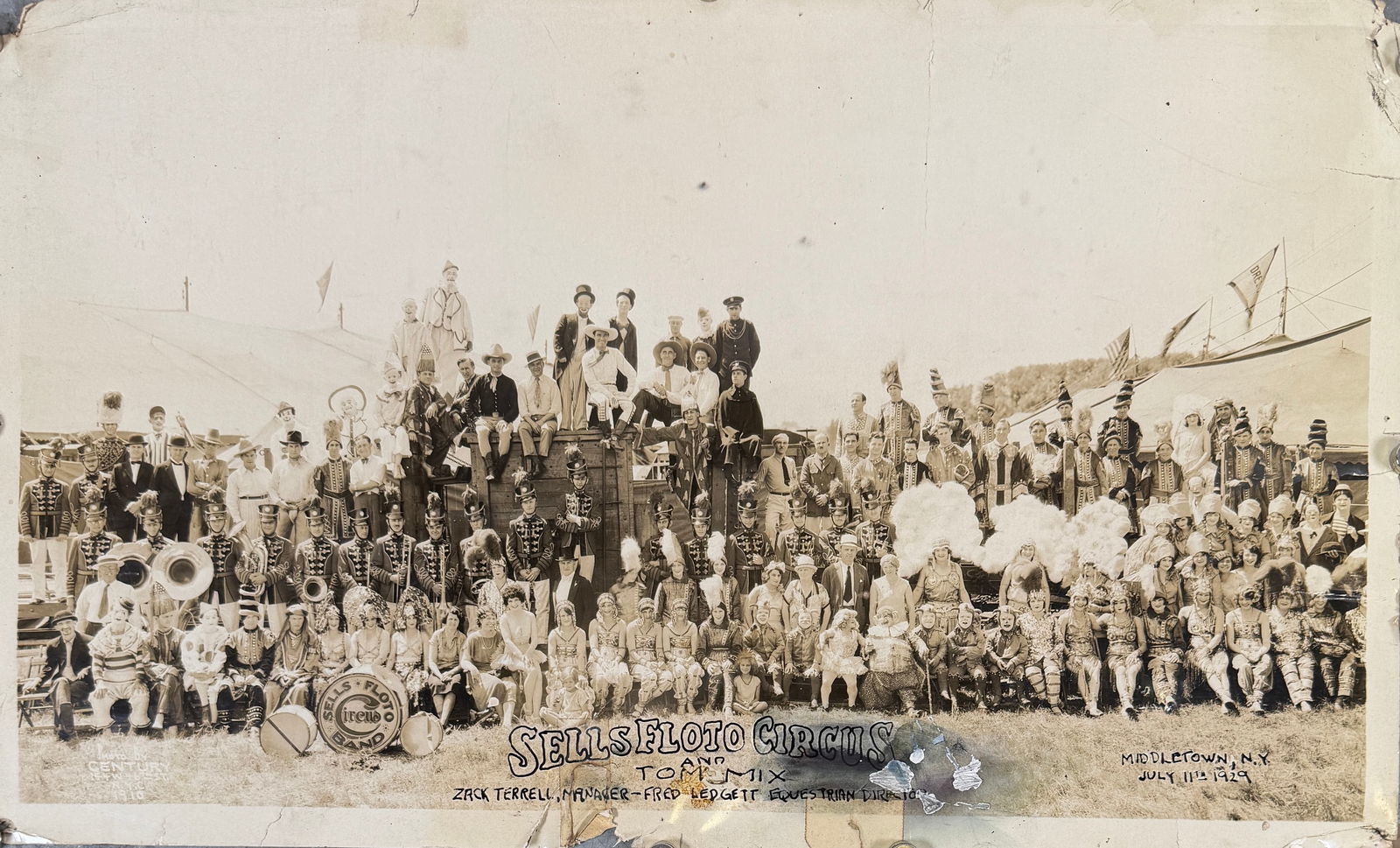 EDWARD J. KELTY CIRCUS PHOTOGRAPH, SELLS-FLOTO: EDWARD J. KELTY (AMERICAN, 1888-1967) PHOTOGRAPH OF THE SELLS-FLOTO CIRCUS, ZACK TERRELL, MGR; FRED LEDGETT, EQUESTRIAN DIRECTOR, MIDDLETOWN, NEW YORK, JULY 11, 1929.PANORAMIC PHOTOGRAPH OF THE CAST