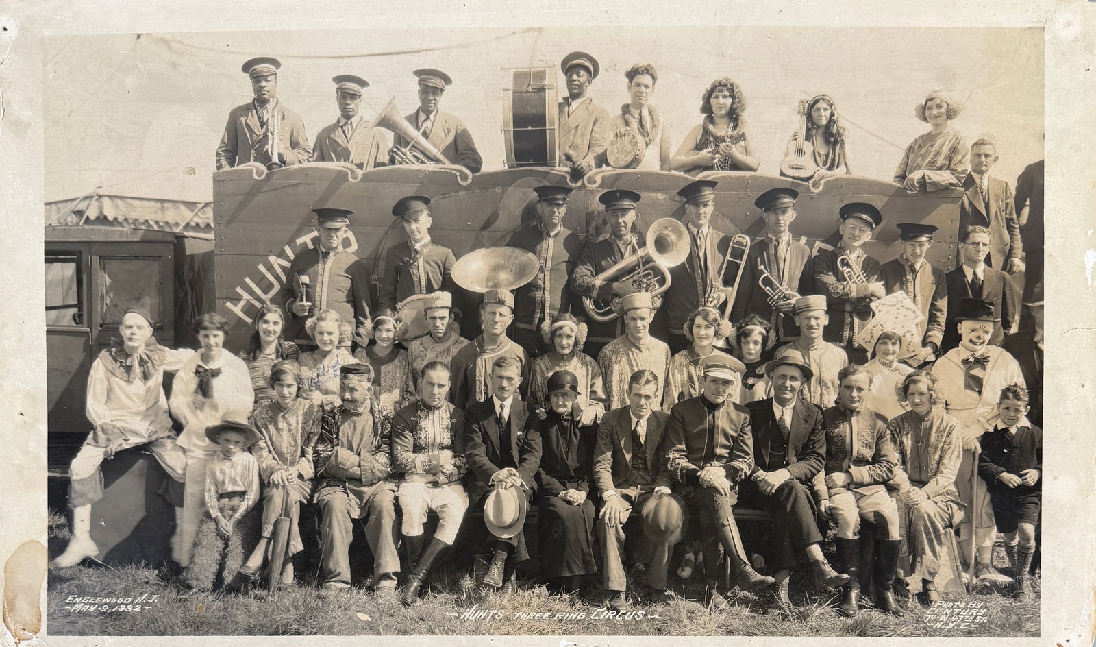 EDWARD J. KELTY HUNT'S CIRCUS PHOTOGRAPH: EDWARD J. KELTY (AMERICAN, 1888-1967) PHOTOGRAPH OF HUNTS THREE RING CIRCUS, OWNERS AND PERFORMERS. ENGLEWOOD, NEW JERSEY, MAY 9, 1932. DOUBLE INK STAMP ON VERSO., EDGEWEAR, TONING. 12"X20"