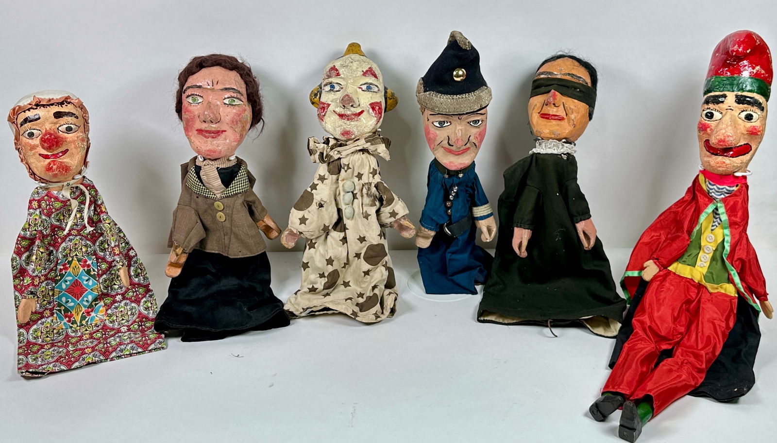 VINTAGE PUNCH AND JUDY CHARACTER SET: HAND-CARVED AND PAINTED PUNCH AND JUDY CHARACTER SET. LIGHT WEAR CONSISTENT WITH AGE AND USE. APPROXIMATELY 20"L