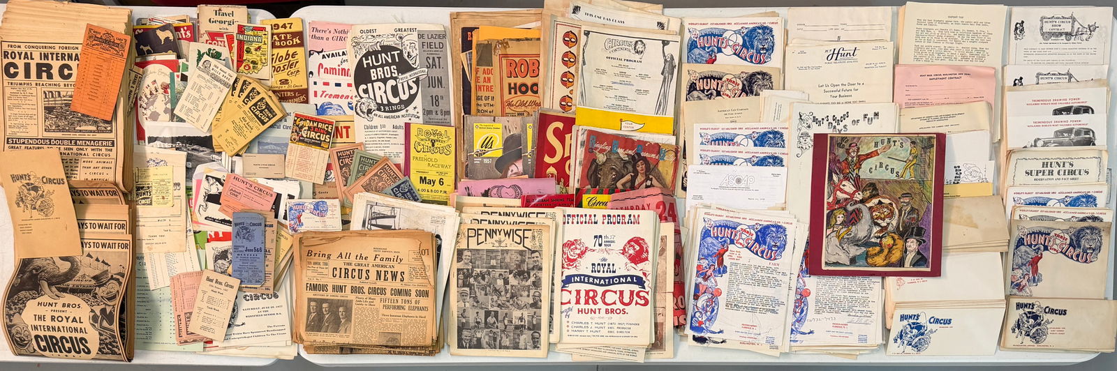 HUNT BROS. CIRCUS MEMORABILIA: TWO BANKER'S BOXES OF HUNT BROS. CIRCUS MATERIALS. LETTERHEAD, COURIERS, FORMS, OFFICE MATERIALS, ROUTE CARDS, PROGRAMS, CHRISTMAS CARDS AND MORE. THE HUNT BROS. CIRCUS OPERATED FROM 1863-1969;