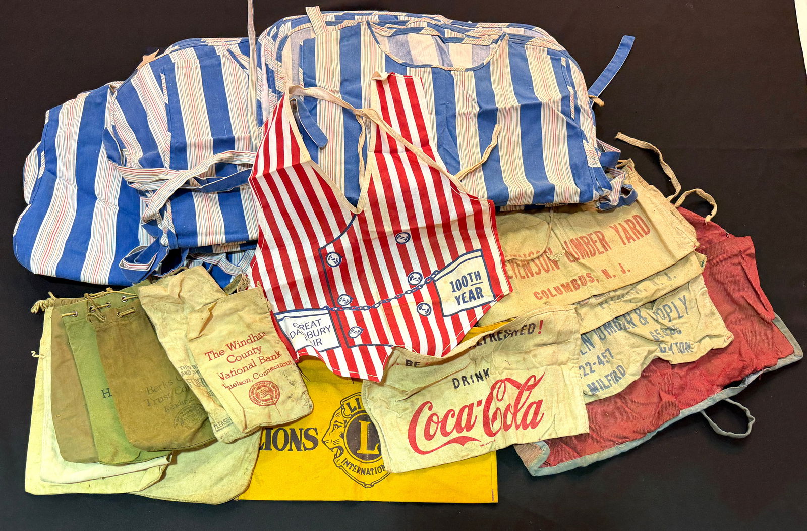 HUNT BROS. CIRCUS MEMORABILIA: LIKELY FOR THE 1970'S RE-VAMP OF THE ORIGINAL SHOW. INCLUDES CONCESSION/VENDING UNIFORMS, APRONS AND CASH BAGS. THE HUNT BROS. CIRCUS OPERATED FROM 1863-1969; 1975-77.