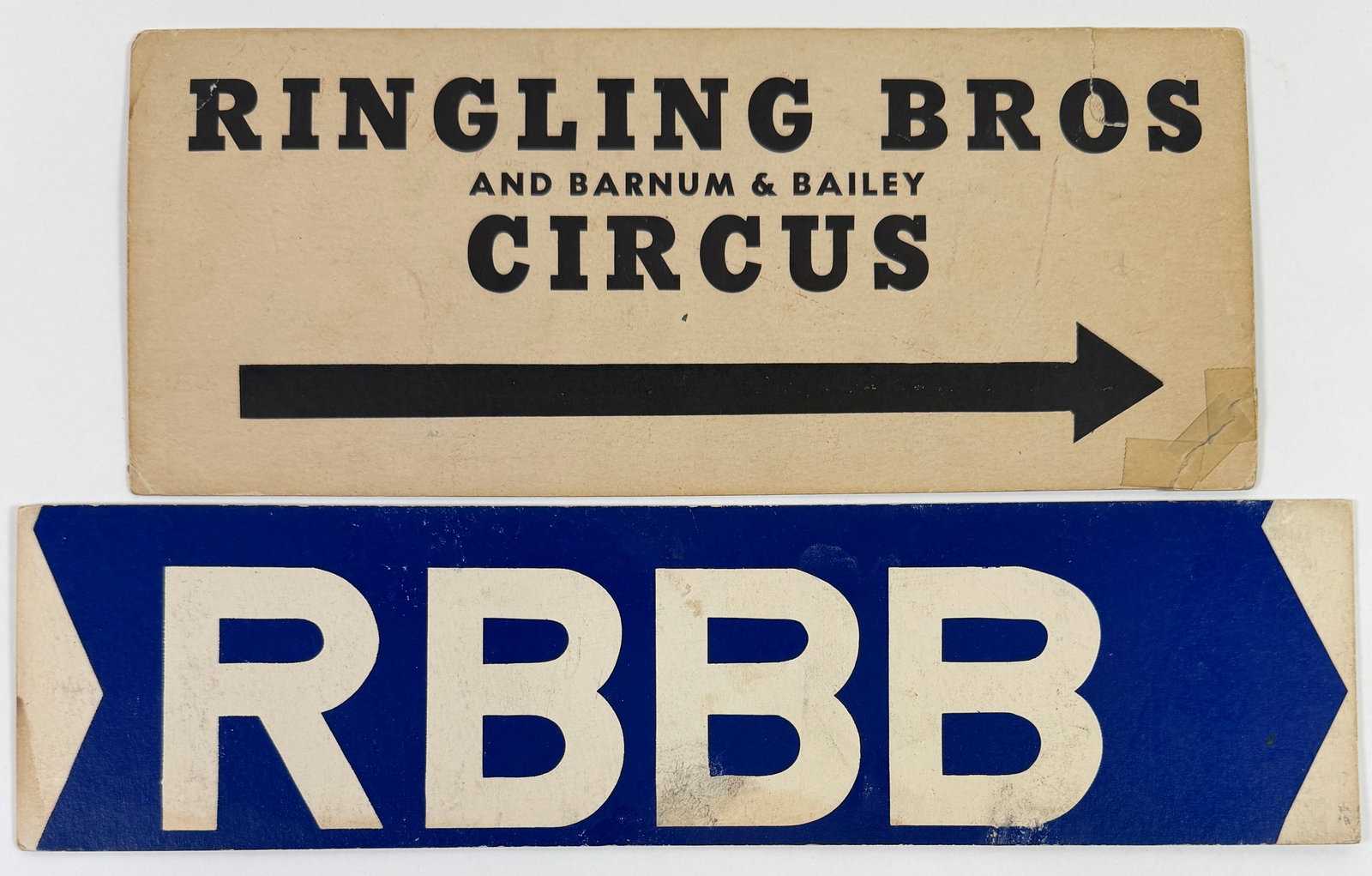 RINGLING BROS. BARNUM & BAILEY CIRCUS ARROWS: FOLLOW THE ARROWS TO THE BIG SHOW. PAIR OF RINGLING-BARNUM SHOW ARROWS, POSTED TO DIRECT TO THE THE LOT. CARD STOCK. BOTH WITH EVIDENCE OF POSTING. LARGEST 5"X12"
