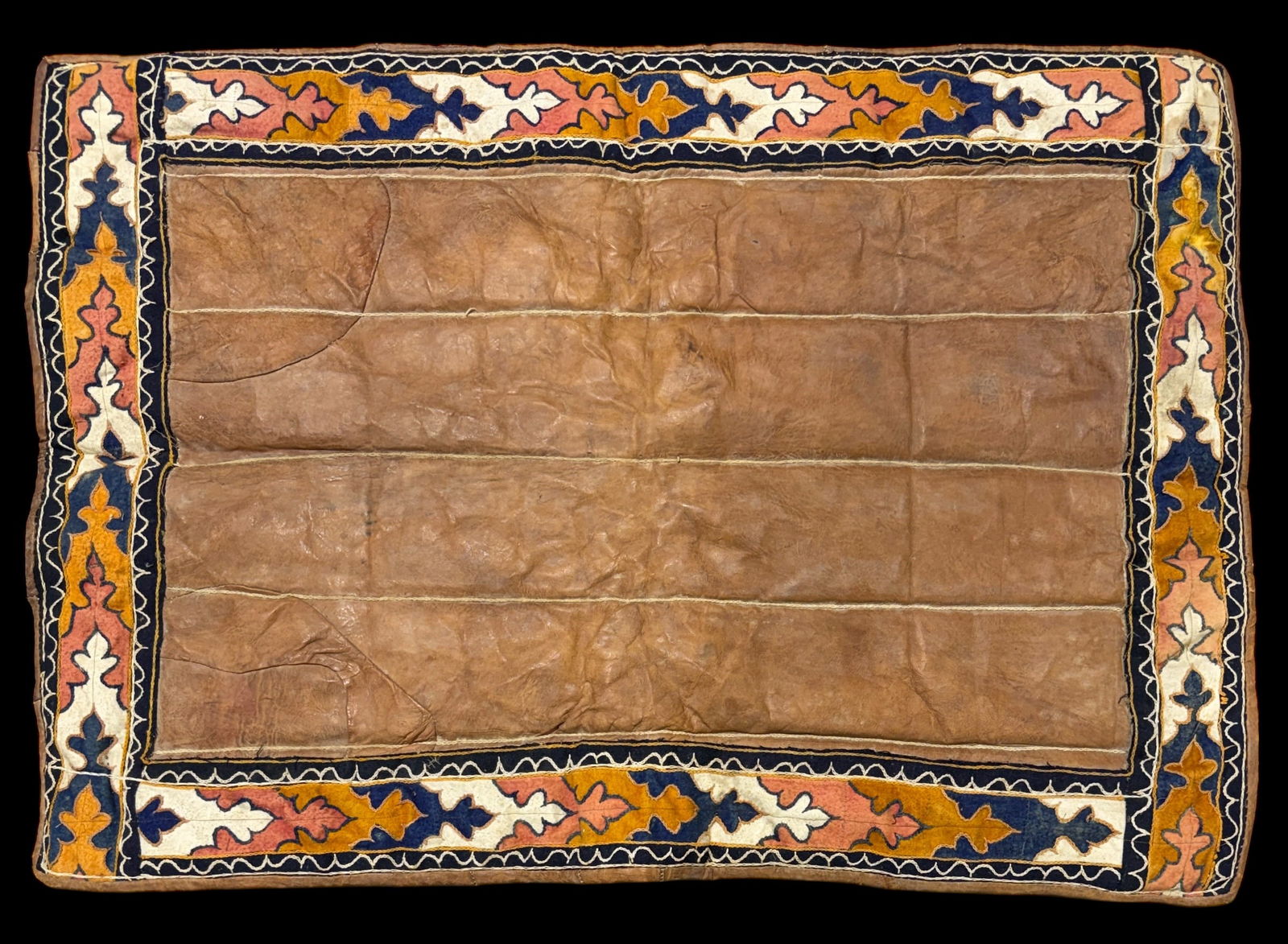 HUNT BROS. CIRCUS CAMEL/HORSE BLANKET: THE HUNT BROS. CIRCUS WAS ONE OF AMERICA'S OLDEST RUNNING CIRCUSES BEGINNING IN 1892. LEATHER WITH EMBROIDERED DESIGNS. 34"X47"
