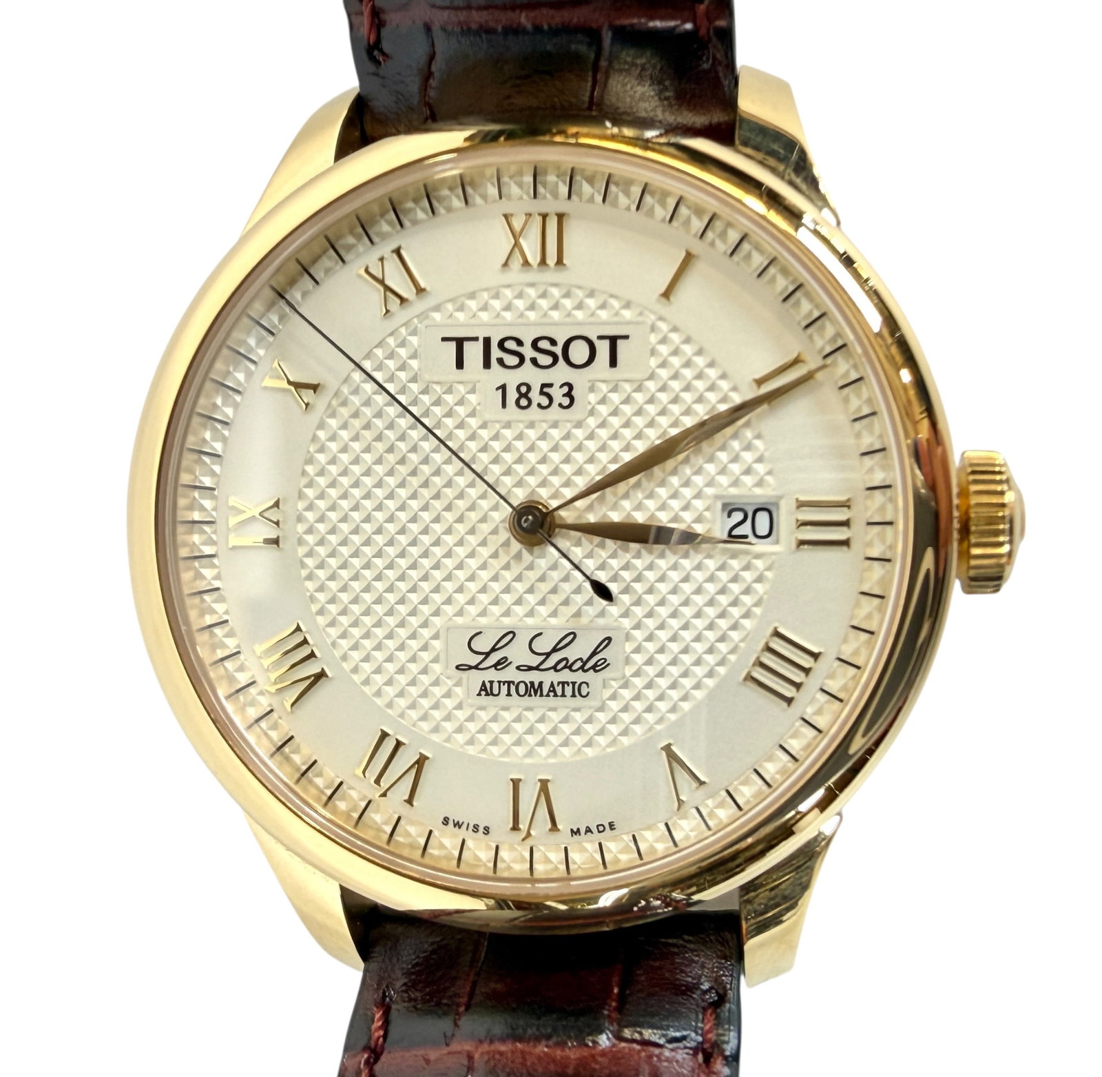 TISSOT 1853 LE LOCLE SWISS WATCH: CREAM DIAL WITH GILT ROMAN NUMERALS, AUTOMATIC, 25 JEWELS, ENGRAVINGS ON REVERSE, STAINLESS, SAPPHIRE LENS, LEATHER STRAP. RUNNING.