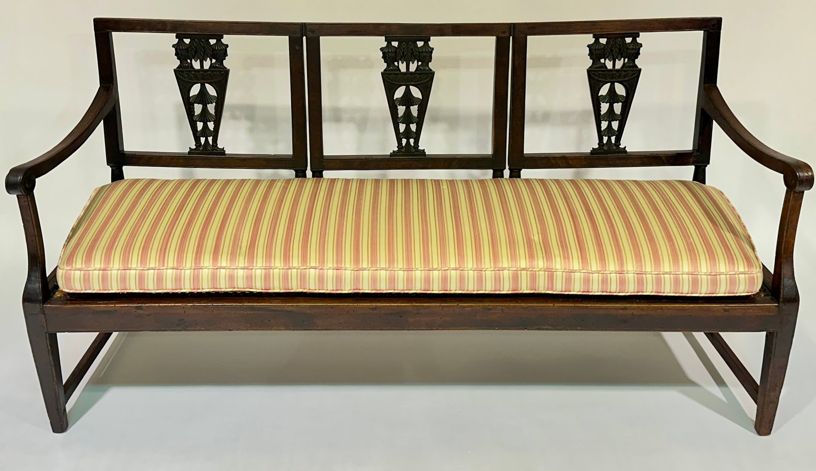 ITALIAN TRIPLE BACK SETTEE: 18TH C. FIGURAL CARVED CHINOISERIE SPLATS WITH RATTAN SEAT. STRIPED, SILK CUSHION.