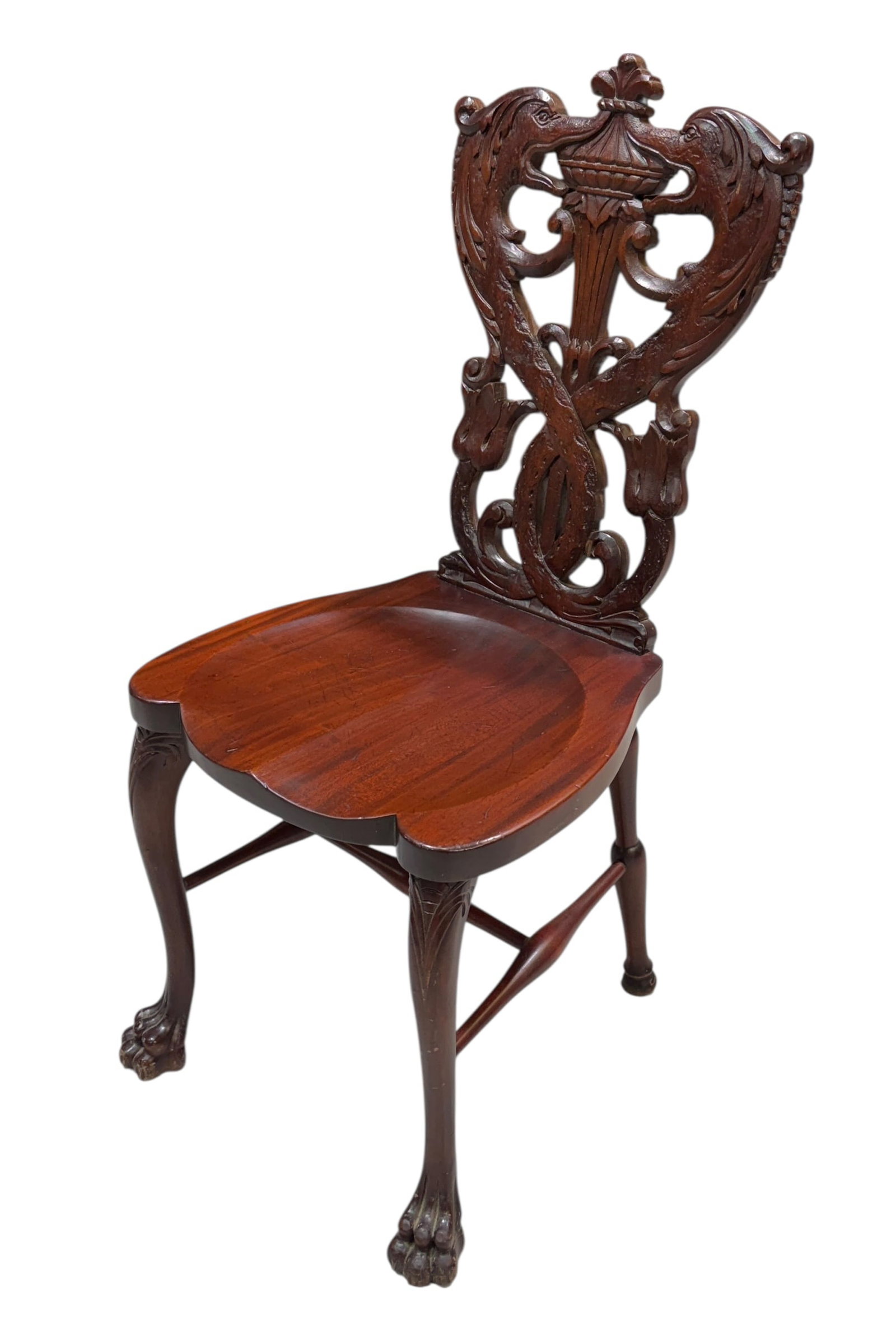 STICKLEY & BRANDT CARVED CHAIR: CARVED BACK, FIGURAL DOLPHIN HEADS, BALL AND CLAW FEET.
