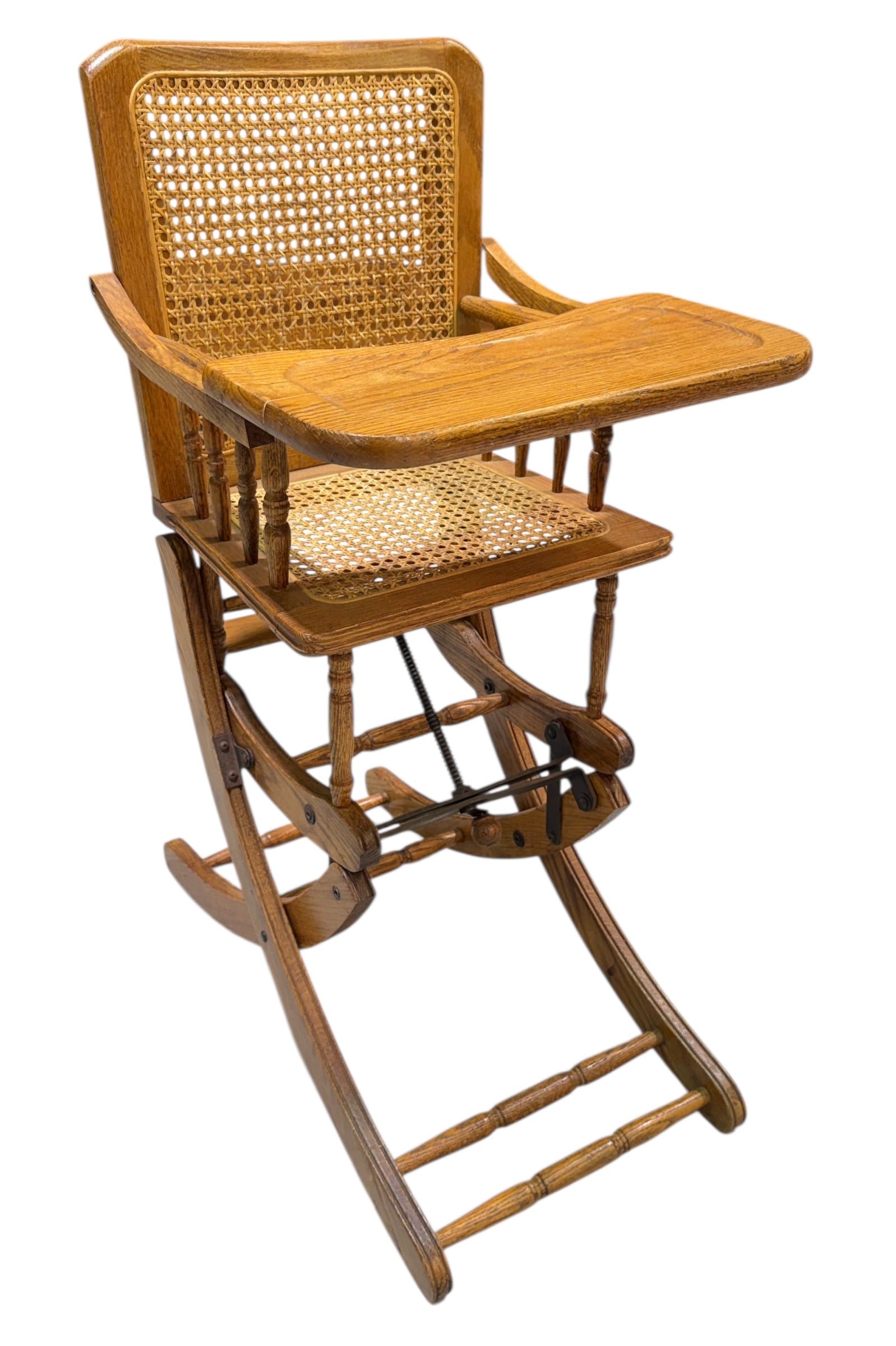 CONVERTIBLE CHILDRENS HIGH CHAIR: TRAY WITH REPAIR, RATTAN SEAT AND BACK.