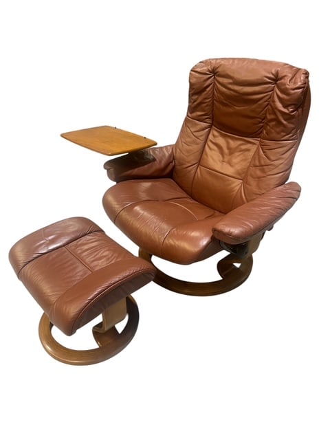 EKORNESS STRESSLESS LOUNGE CHAIR WITH OTTOMAN: RUST-TONED. LIGHT WEAR ACCOMPANIED WITH USE. LABELED.