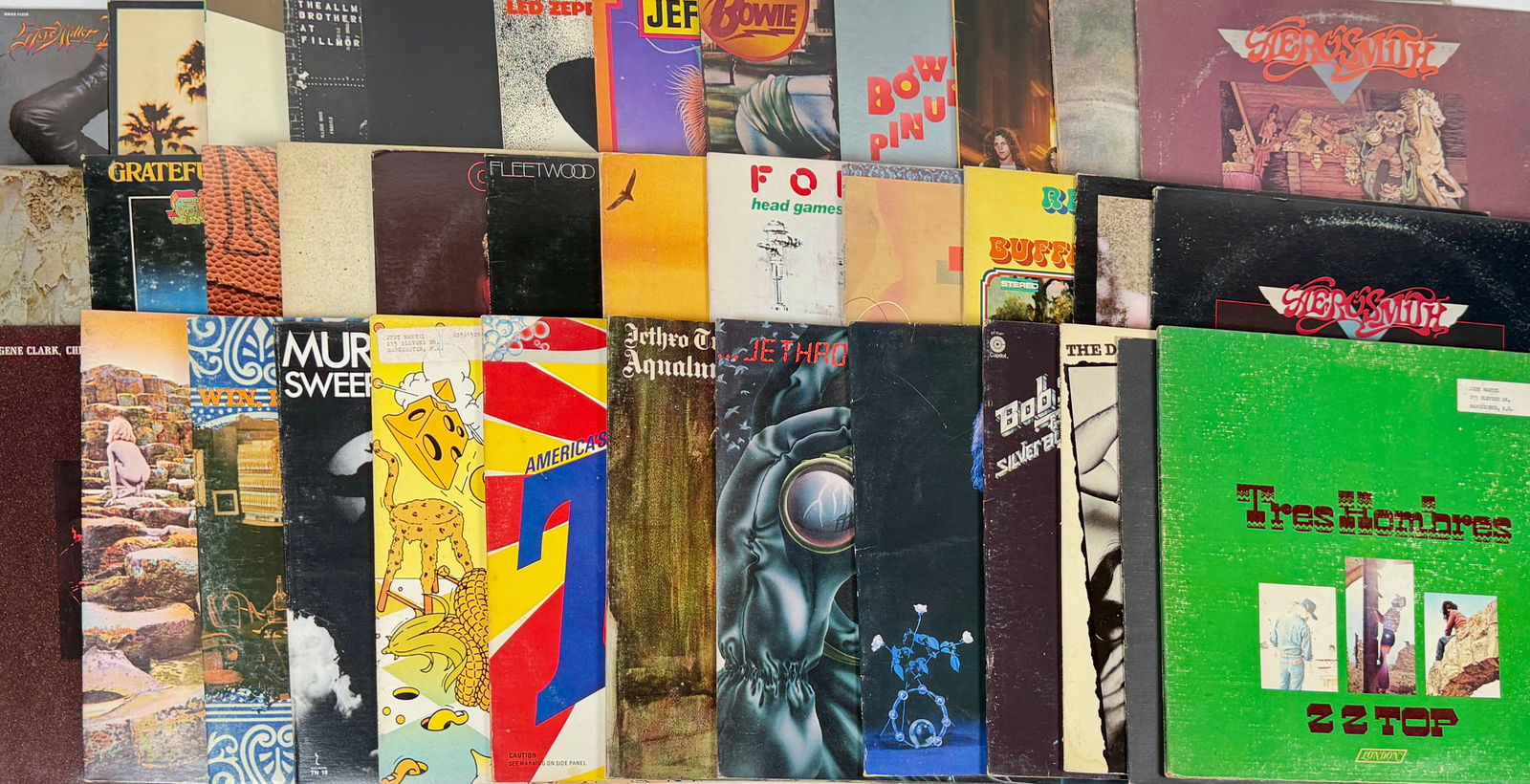 VINTAGE ROCK LP VINYL RECORD ALBUMS: 30+ ROCK ALBUMS FROM THE 1970'S AND 1980'S. FEW WITH PERSONAL PROPERTY LABELS ON FACE OF COVER. INCLUDING: DAVID BOWIE, HEART, FLEETWOOD MAC, GRATEFUL DEAD, DOOBIE BROS. JETHRO TULL, SKYNRD, JEFFERSON