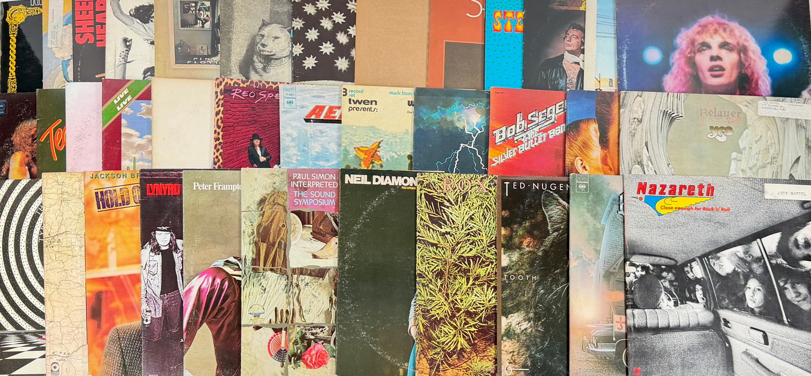 VINTAGE ROCK LP VINYL RECORD ALBUMS: 30+ ROCK ALBUMS FROM THE 1970'S AND 1980'S. FEW WITH PERSONAL PROPERTY LABELS ON FACE OF COVER. INCLUDING: BILLY JOEL, BEE GEES, STANLEY CLARKE, NUGENT, SEGER, HENDRIX, SKYNYR, JEFFERSON AIRPLANE