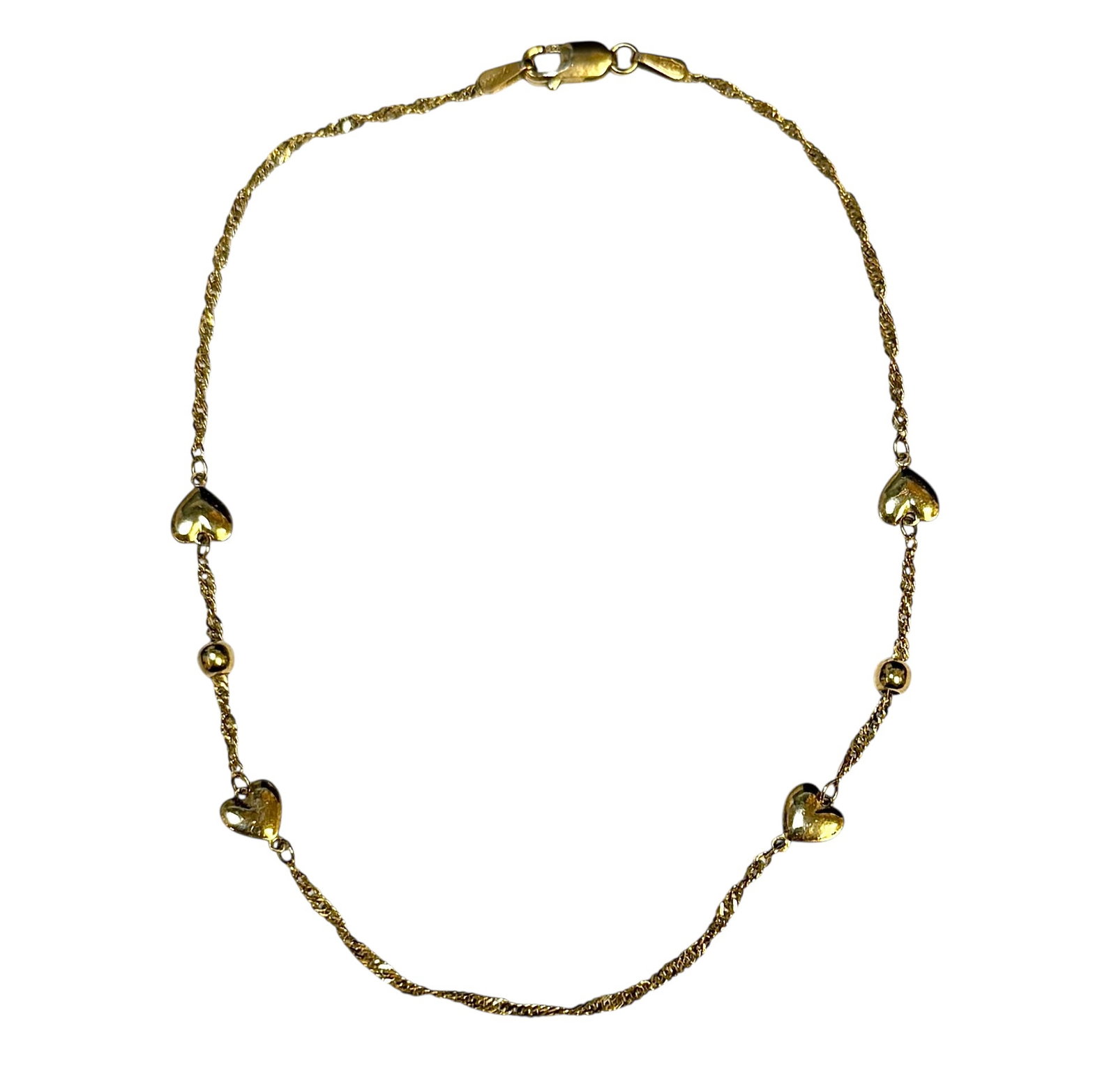 GOLD HEART BRACELET - JEWELRY: 14K YELLOW GOLD WITH ACCENTING HEARTS. 8.5". 2 GRAMS TOTAL WEIGHT.