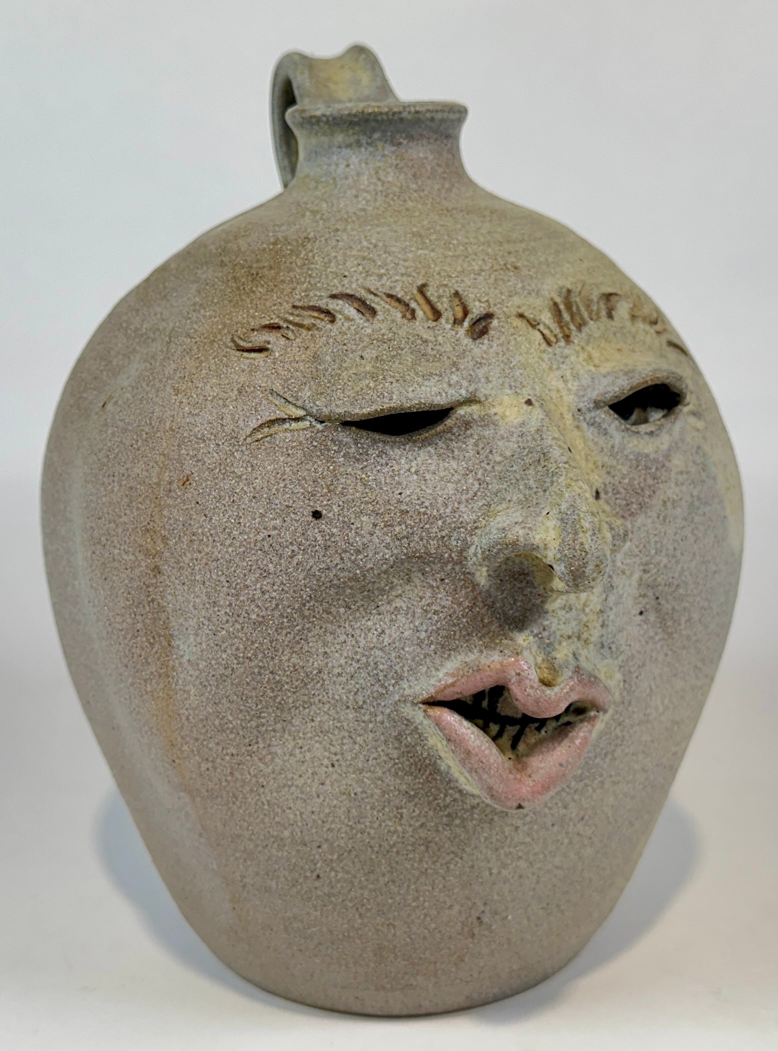 FOLK ART AMERICANA STONEWARE CHARACTER JUG: GEORGE MCCAULEY (AMERICAN, SAVANNAH, GA. B.1947) 9.5"H