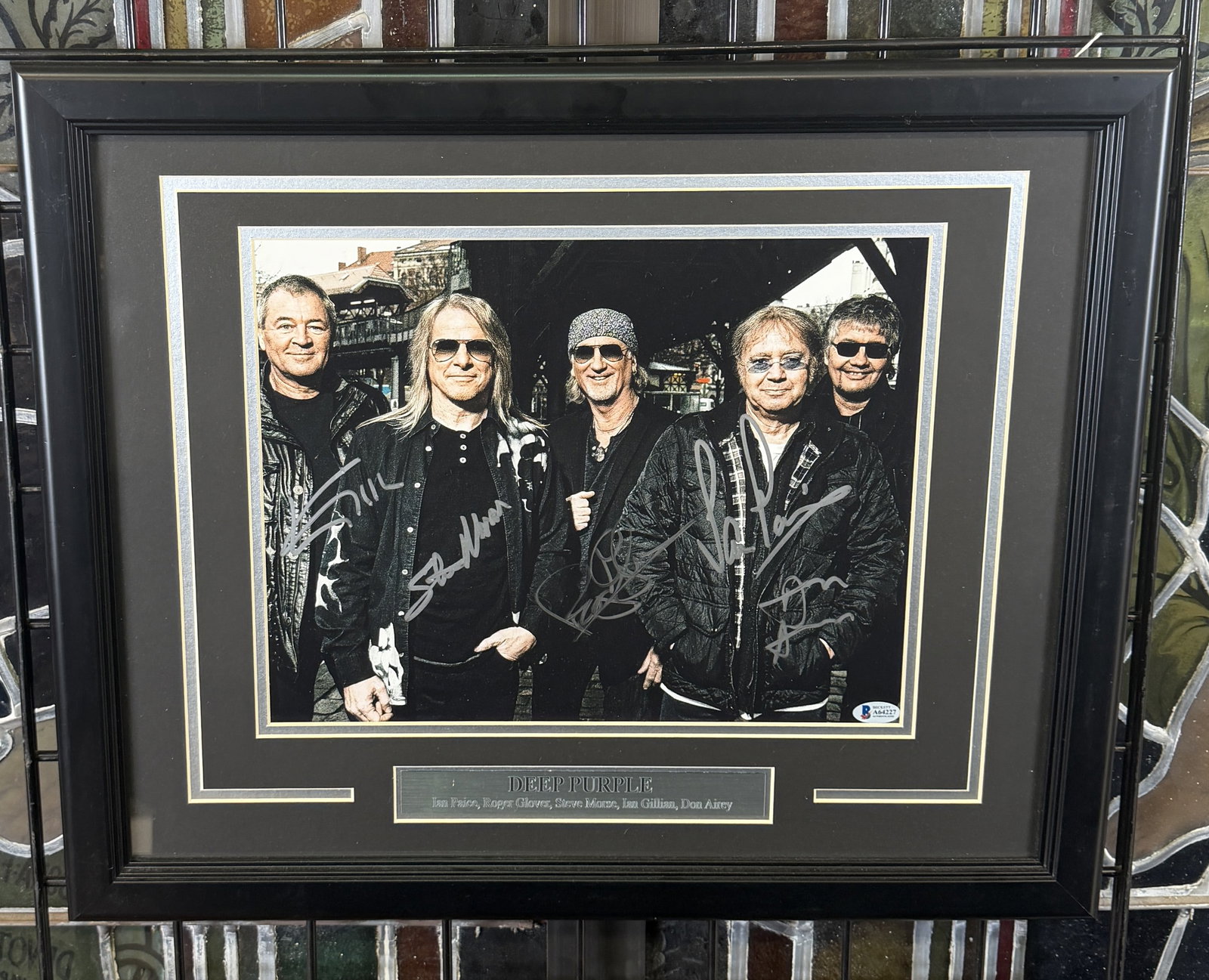 DEEP PURPLE BAND AUTOGRAPHED PHOTO DISPLAY: FRAMED DISPLAY FEATURING DEEP PURPLE WITH AUTOGRAPHS IN SILVER. IAN PAICE, ROGER GLOVER, STEVE MORSE, IAN GILLIAN, DON AIREY. BECKETT CERTIFIED. PROFESSIONALLY FRAMED. 19"X22'