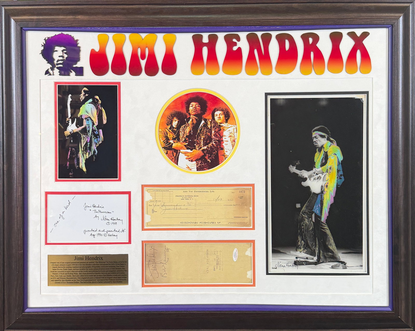 JIMI HENDRIX - AUTOGRAPH DISPLAY: PROFESSIONALLY FRAMED DISPLAY FEATURING A CHECK MADE PAYABLE TO JIMI HENDRIX, ENDORSED ON VERSO. CERTIFICATES BY AAU AND FORUM SHOPS, LAS VEGAS. 25"X32"
