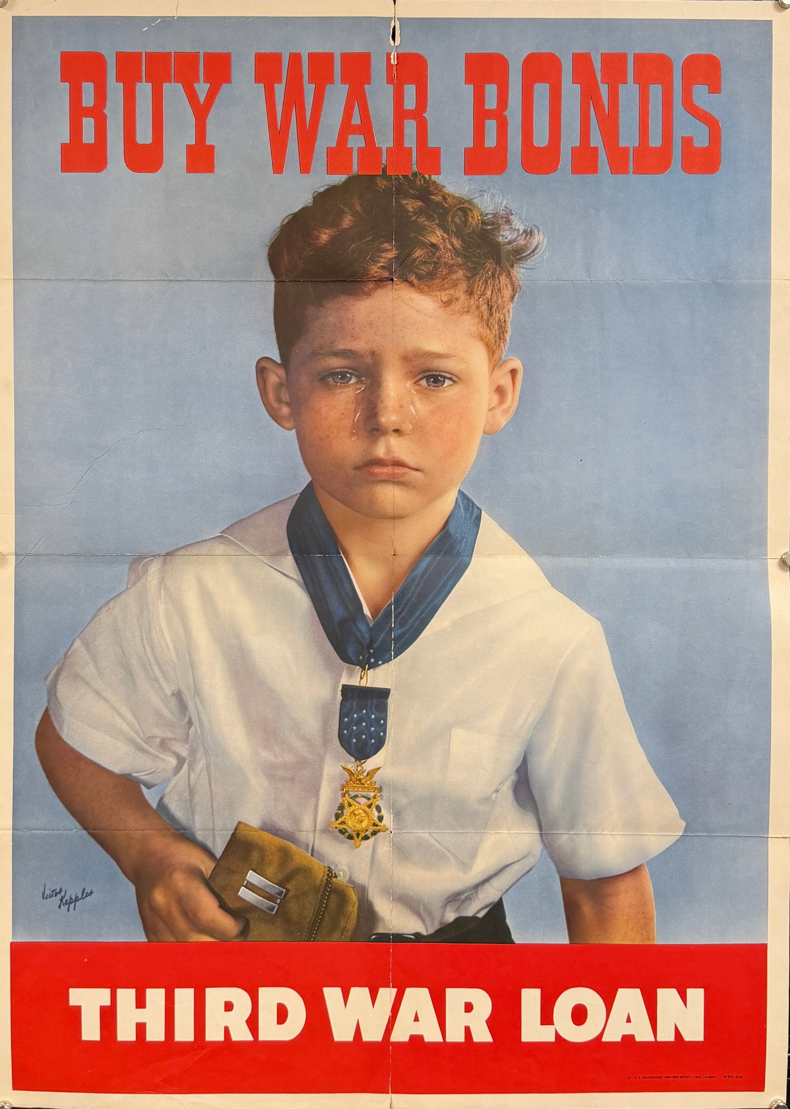 1943 U.S. BUY WAR BONDS CAMPAIGN POSTER: SECOND WORLD WAR PROPAGANDA POSTER - BUY WAR BONDS - THIRD WAR LOAN. DESIGN BY VICTOR KEPPLES FEATURING A YOUNG BOY WITH TEARS STREAMING DOWN HIS FACE, HOLDING A SOLDIER'S CAP WHILE HOLDING A MEDAL OF