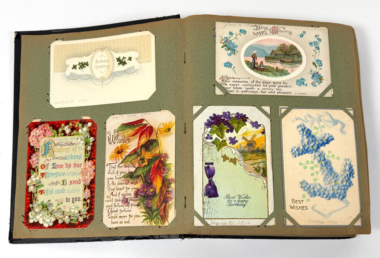 VINTAGE POSTCARD ALBUM: VINTAGE ALBUM CONTAINING APPROX. 250 VINTAGE POSTCARDS, VARIOUS HOLIDAYS. NO RPPC, NO HALLOWEEN. BOOK IS LOOSE AT BINDING BUT COMPLETE. CARDS HAVE NOT BEEN EXAMINED OUTSIDE OF ALBUM TO CONFIRM POSTAL