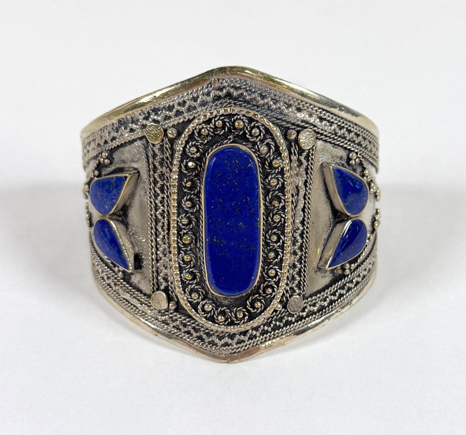 ALPACA SILVER LAPIS LAZULI CUFF BRACELET: TRIBAL BRACELET WITH LAPIS LAZULI ACCENTS. 3.25", 1.25" OPENING. 52 GRAMS.