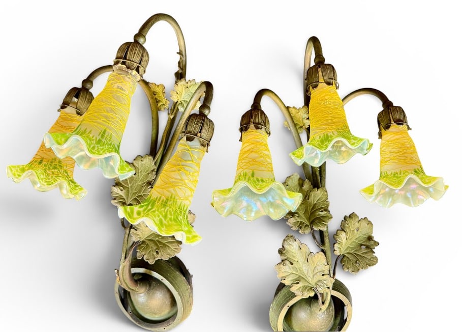 BOHEMIAN ART NOUVEAU SCONCES: PAIR OF THREE-LIGHT PATINATED WALL SCONCES WITH TULIP ART GLASS SHADES. THREADED DESIGNS. SCATTERED FITTER CHIPS AND LOSS TO GLASS SHADES. SHADES ARE 4.75". WALL SCONCE WITH ONE LEAF DETACHED BUT
