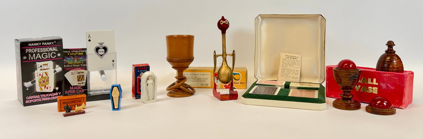 MAGIC - COLLECTION OF MAGICIAN IMPLEMENTS: PLAYING CARDS, KING TUT MAGIC MUMMY, BALL VASES, VENUS IN THE BATH, MAGNETIC SCOTTIES, HANKY PANKY TAPPER CARDS AND HOLDER, HIRATA PEACE BIRD.