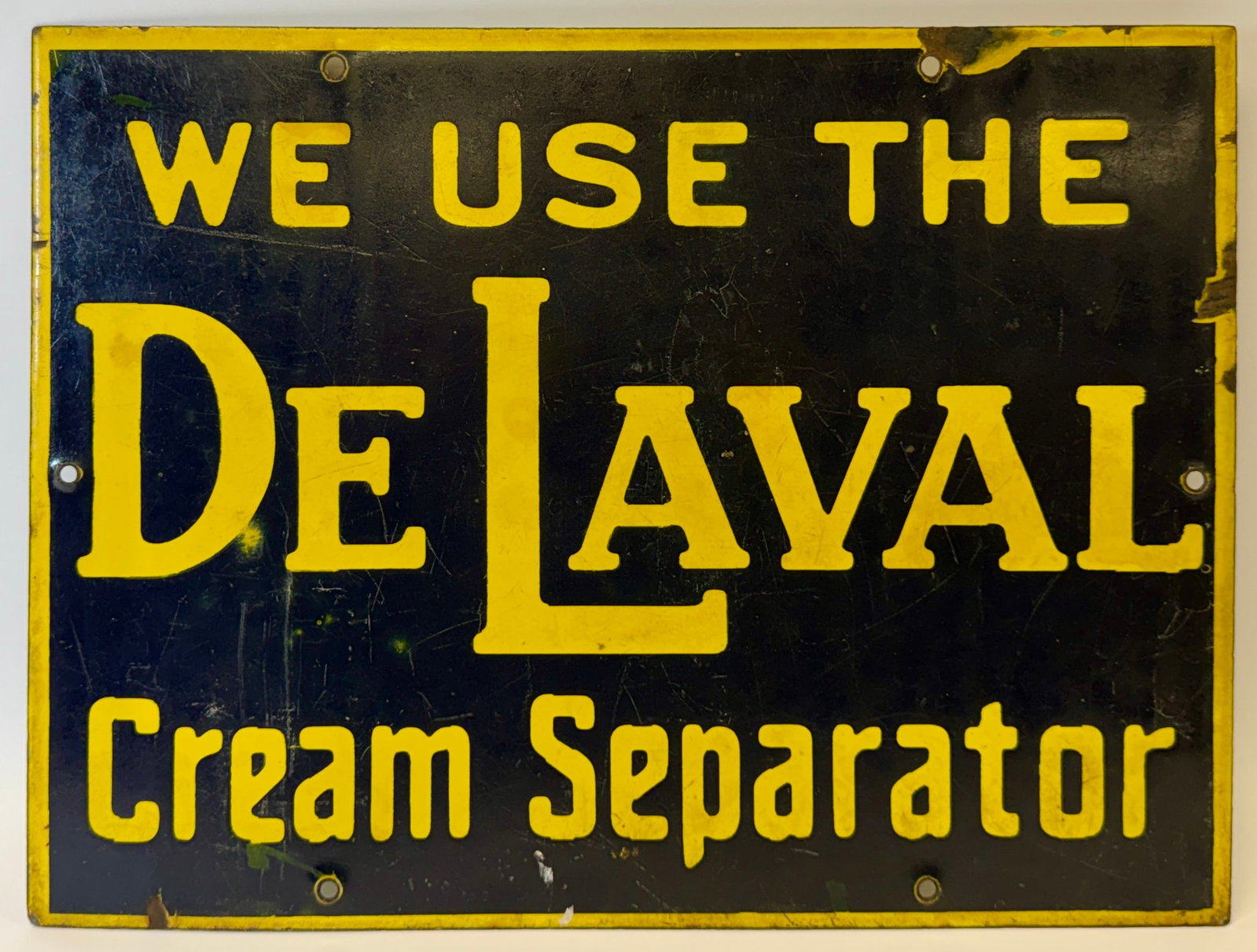 DE LAVAL CREAM SEPARATOR PORCELAIN SIGN: ORIGINAL ADVERTISING SIGN FOR DE LAVALL. AREAS OF FINISH LOSS CONSISTENT WITH AGE. 12"X16"