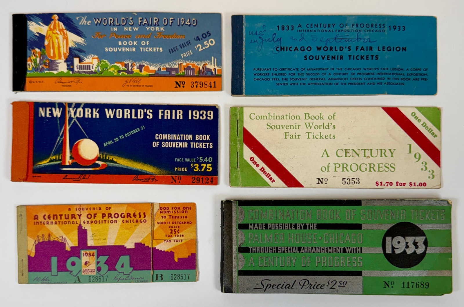 NEW YORK WORLD'S FAIR TICKET BOOKS: COLLECTION OF USED TICKET BOOKS FOR THE WORLD'S FAIR. MOST STUBS REDEEMED. 1933(3), 1934, 1939, 1940. CASE AS SHOWN NOT INCLUDED.