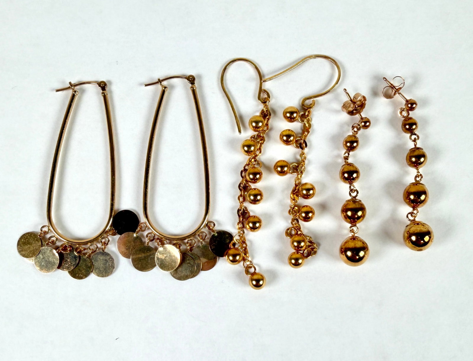 14K GOLD EARRING COLLECTION: LOT OF THREE DROP EARRINGS. 6.3 GRAMS IN TOTAL WEIGHT.