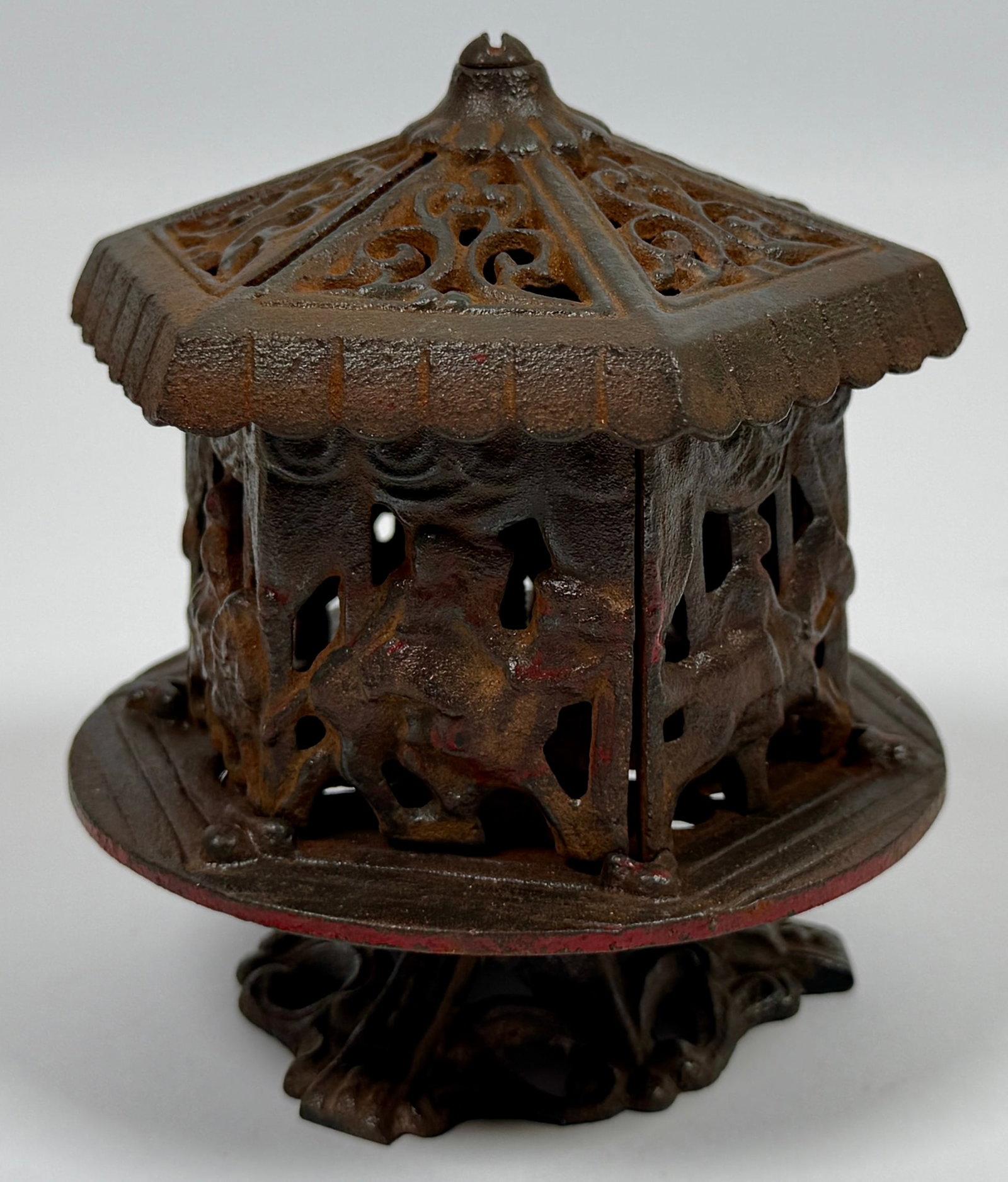 ANTIQUE CAST IRON CAROUSEL COIN BANK (1 of 3)