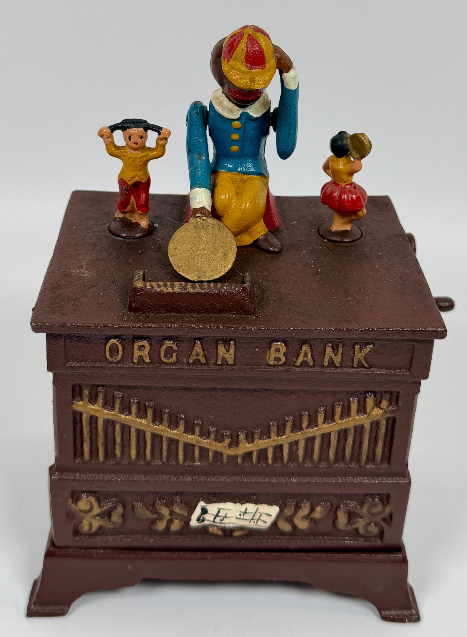 VINTAGE BOOK OF KNOWLEDGE COIN BANK: BOOK OF KNOWLEDGE REPRODUCTION ORGAN MECHANICAL COIN BANK. CRANK PLAYS BELL MUSIC. WORKING CONDITION. 7"X3.5"X5.5"