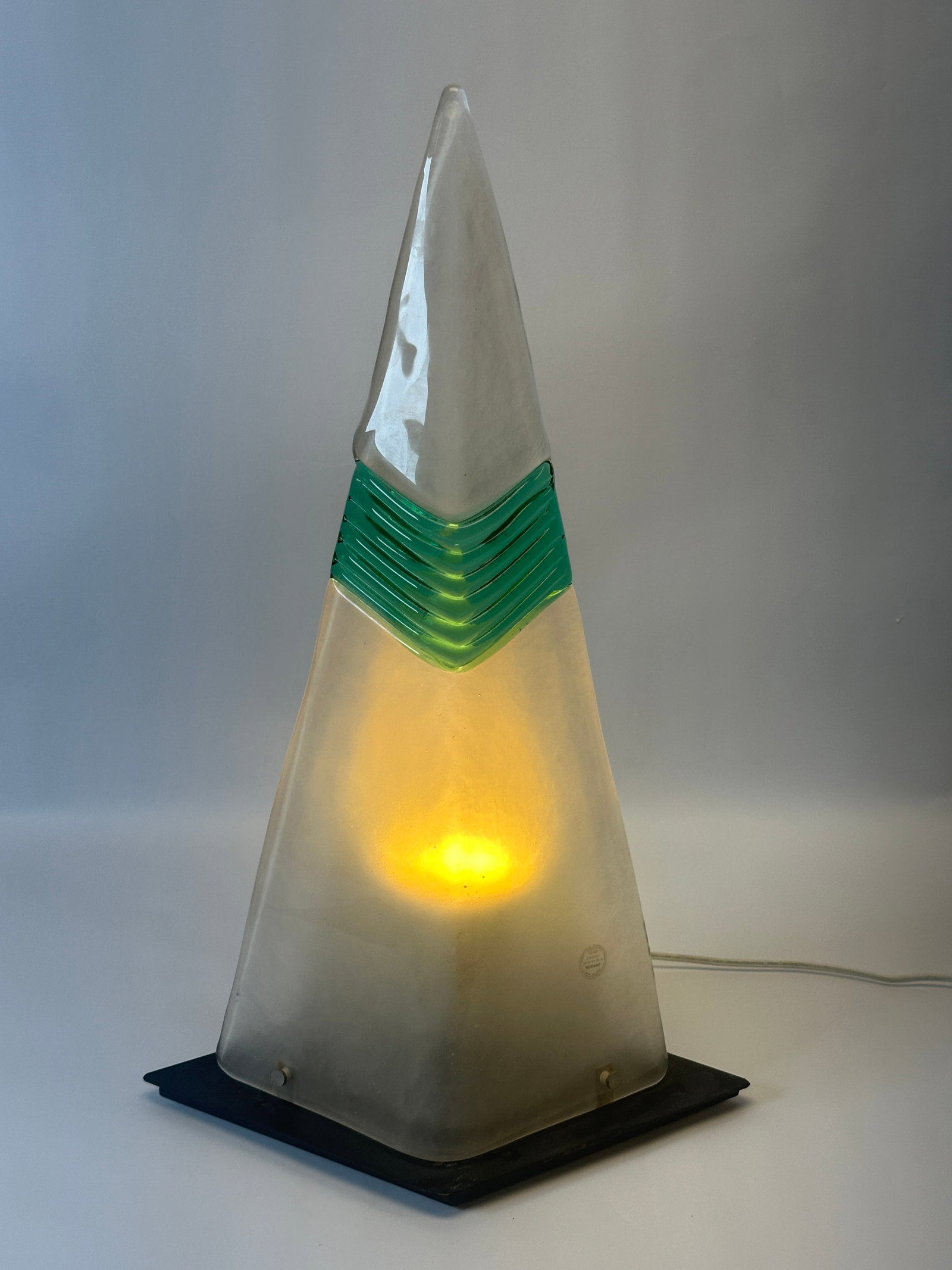 CARLO NASON FOR AV MAZZEGA (ATTR.) PYRAMID LAMP: MURANO ART GLASS PYRAMID LAMP, FROSTED TRIANGULAR BLOWN GLASS WITH EMERALD GREEN GLASS ACCENTS. 23"H. CONDITION REPORT AVAILABLE ON REQUEST. CANNOT ISSUE REPORTS WHILE AUCTION IS IN PROGRESS.