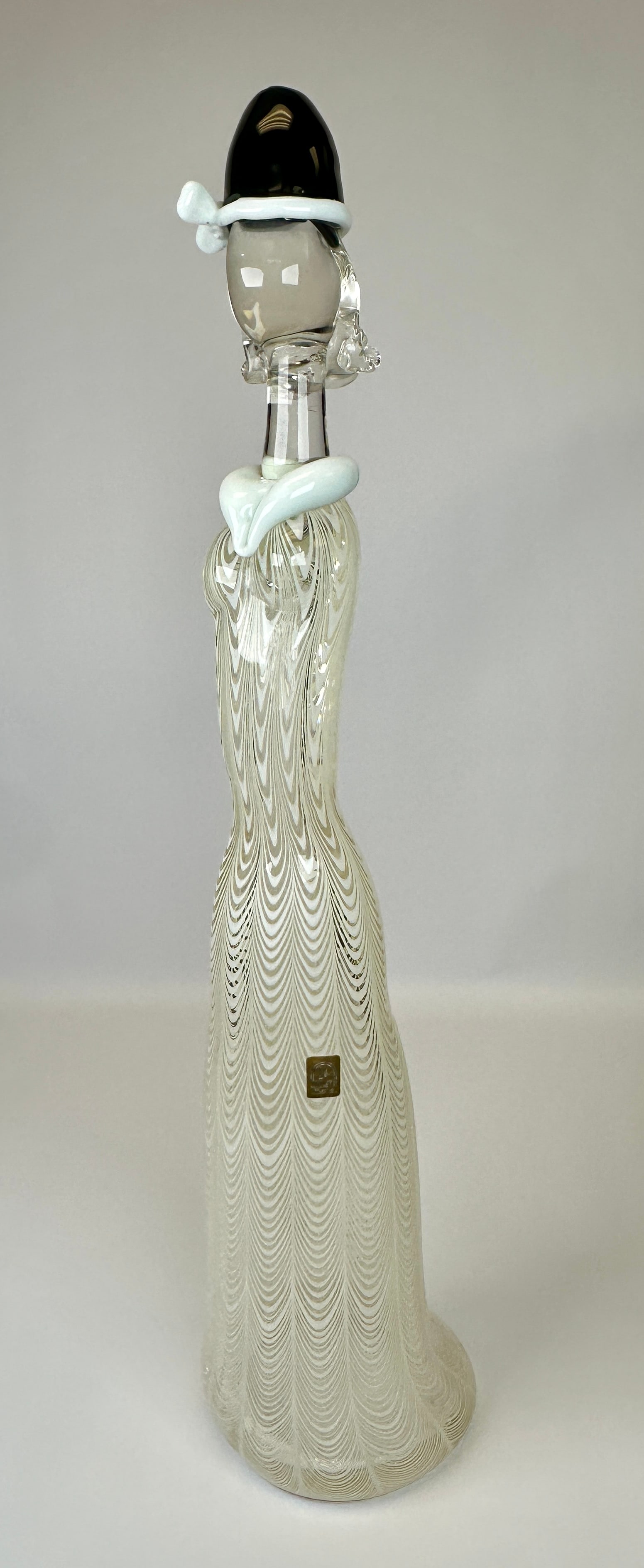 OSCAR ZANETTI MURANO ART GLASS SCULPTURE: SIGNED OSCAR ZANETTI WITH ZANETTI LABEL. WHITE PULLED/DRAPE DESIGNS. CRAQUELURE ON BASE. 23"H. CONDITION REPORT AVAILABLE ON REQUEST. CANNOT ISSUE REPORTS WHILE AUCTION IS IN PROGRESS.