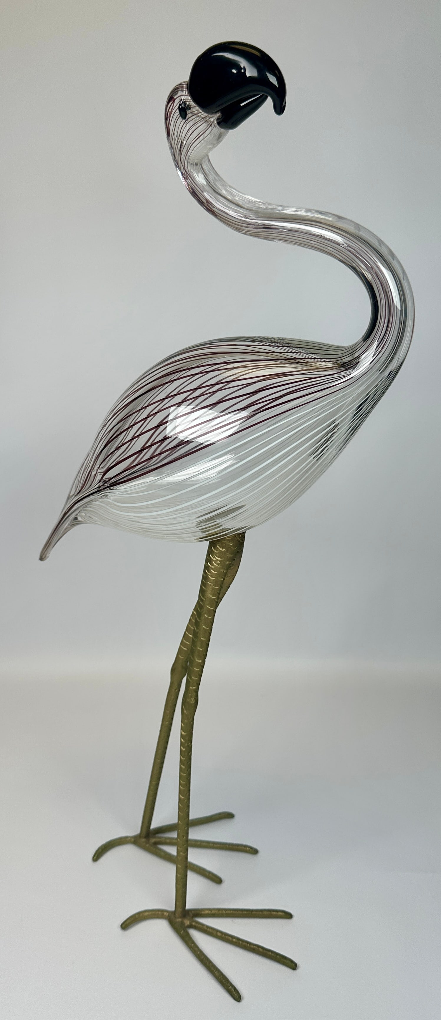 LICIO ZANETTI FOR VETRI MURANO ART GLASS FLAMINGO: SIGNED ZANETTI L. BRASS-TONED LEGS AND FEET WITH STRIPED ART GLASS BODY. CONDITION REPORT AVAILABLE ON REQUEST. CANNOT ISSUE REPORTS WHILE AUCTION IS IN PROGRESS.