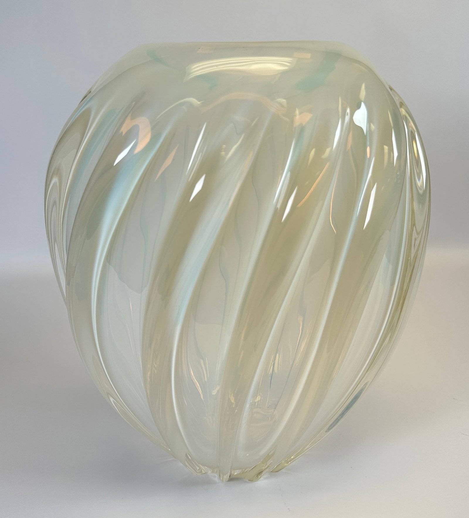 LARRY LASLO (ATTR.) FOR MIKASA ART GLASS VASE: UNSIGNED. HEAVY ART GLASS VASE WITH SWIRL OPALESCENT DESIGNS. 12"H. CONDITION REPORT AVAILABLE ON REQUEST. CANNOT ISSUE REPORTS WHILE AUCTION IS IN PROGRESS.