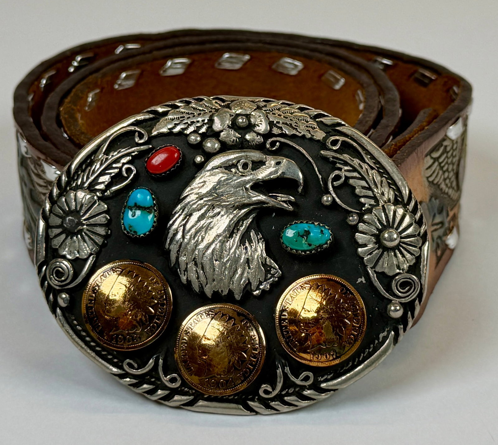 SOUTHWESTERN BELT WITH BUCKLE: TURQUOISE AND INDIAN HEAD CENT INSERTS, LEATHER TOOLED EAGLE MOTIF BELT. MARKED S.S.T.