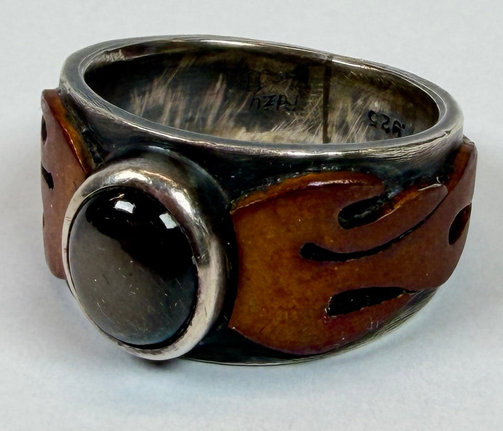 STERLING SILVER MEN'S RING: STERLING WITH COPPER FLAME CUT-OUTS, MOONSTONE. 15 GRAMS TOTAL WEIGHT. SIZE 9