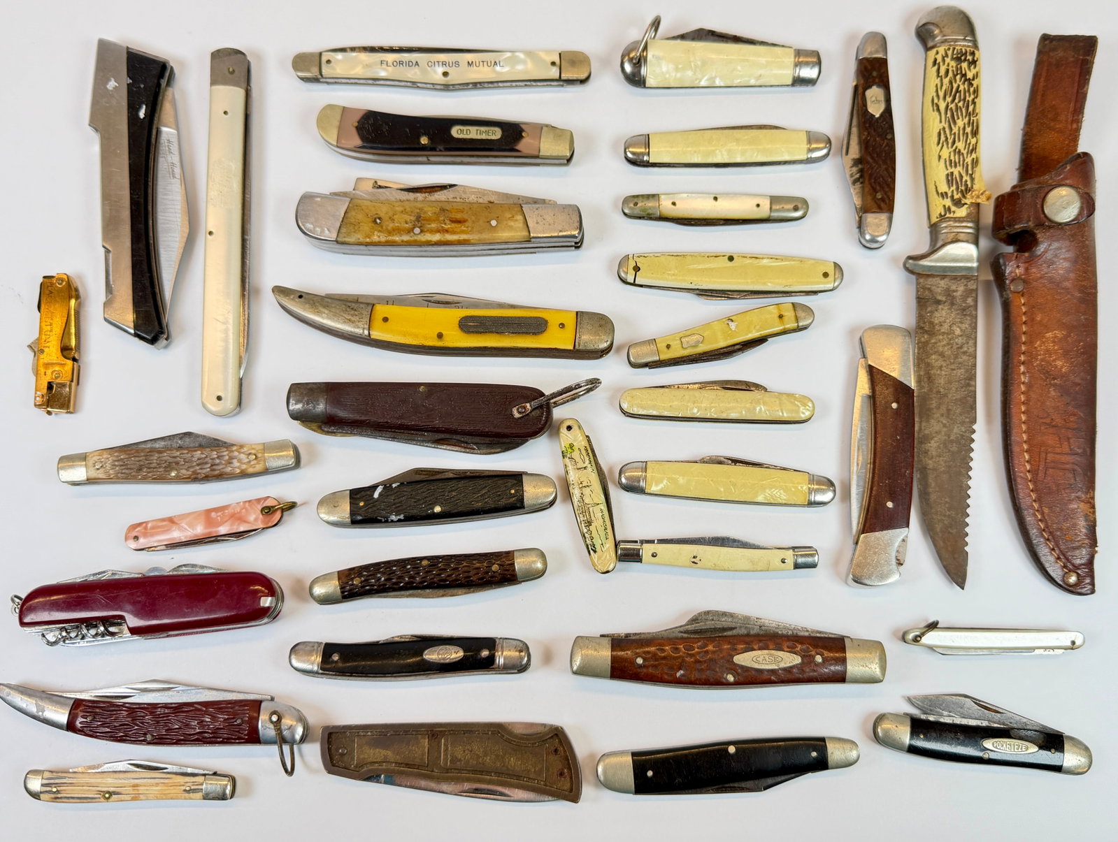 COLLECTION OF KNIVES: FIXED, FOLDING. IMPERIAL, OLD TIMER, BUCK AND OTHERS.