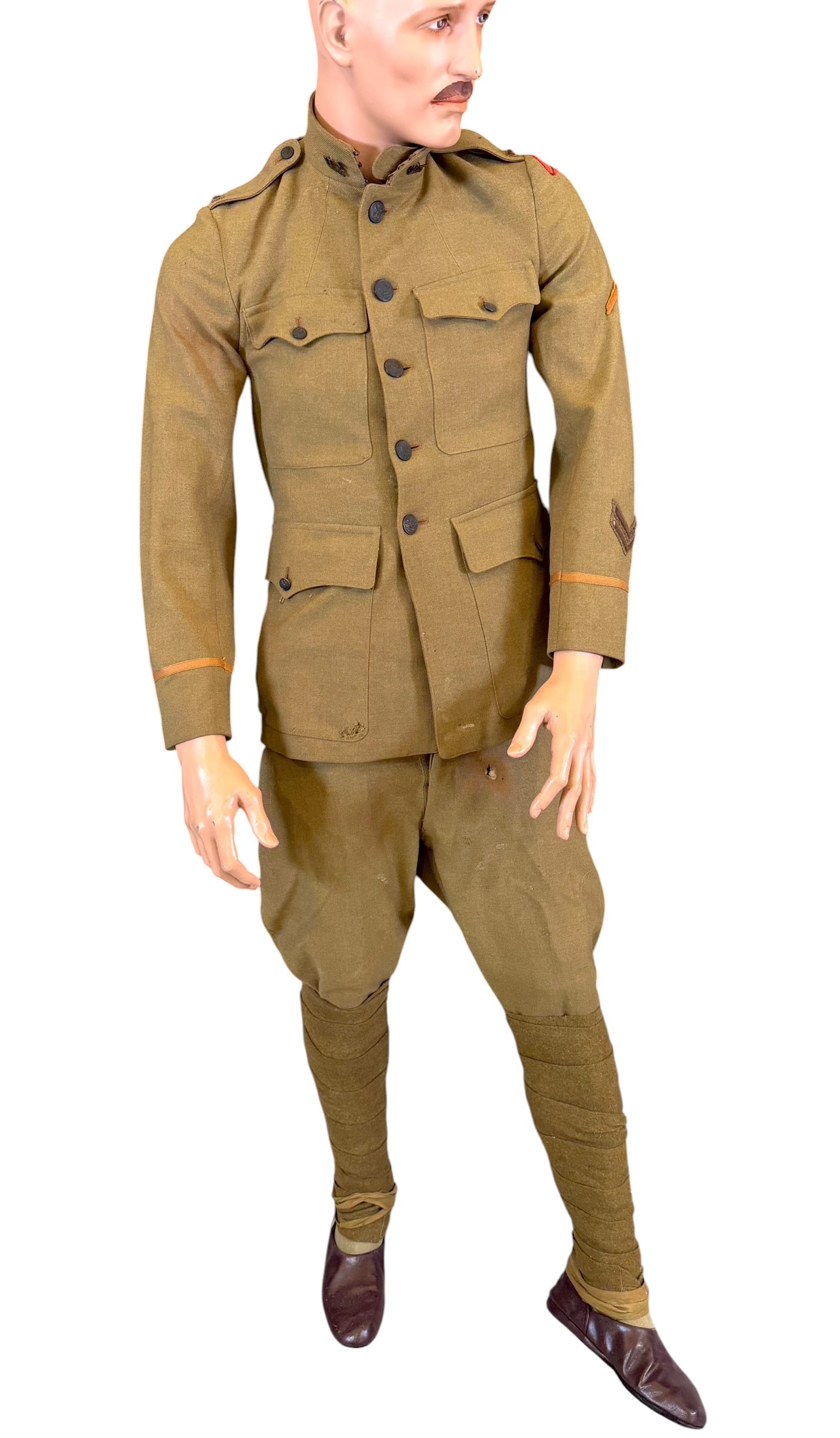 U.S. WWI MILITARY UNIFORM: INCLUDED WITH THE UNIFORM IS A FRAMED PHOTOGRAPH AND PAIR OF FRAMED REAL PHOTO POSTCARDS OF THE SOLDIER WHO PURPORTEDLY WORE THIS UNIFORM IN SERVICE. NOT IDENTIFIED. BUYER MAY ABANDON MANNEQUIN AS IT