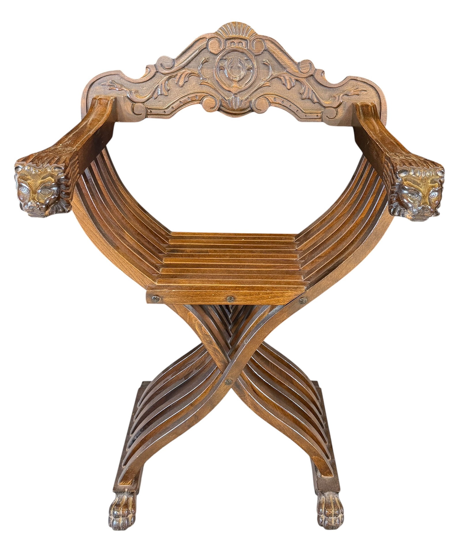VINTAGE SAVONAROLA CHAIR: CARVED WOOD SCISSOR-STYLE CHAIR WITH LION ARMS, INTRICATE CARVINGS.